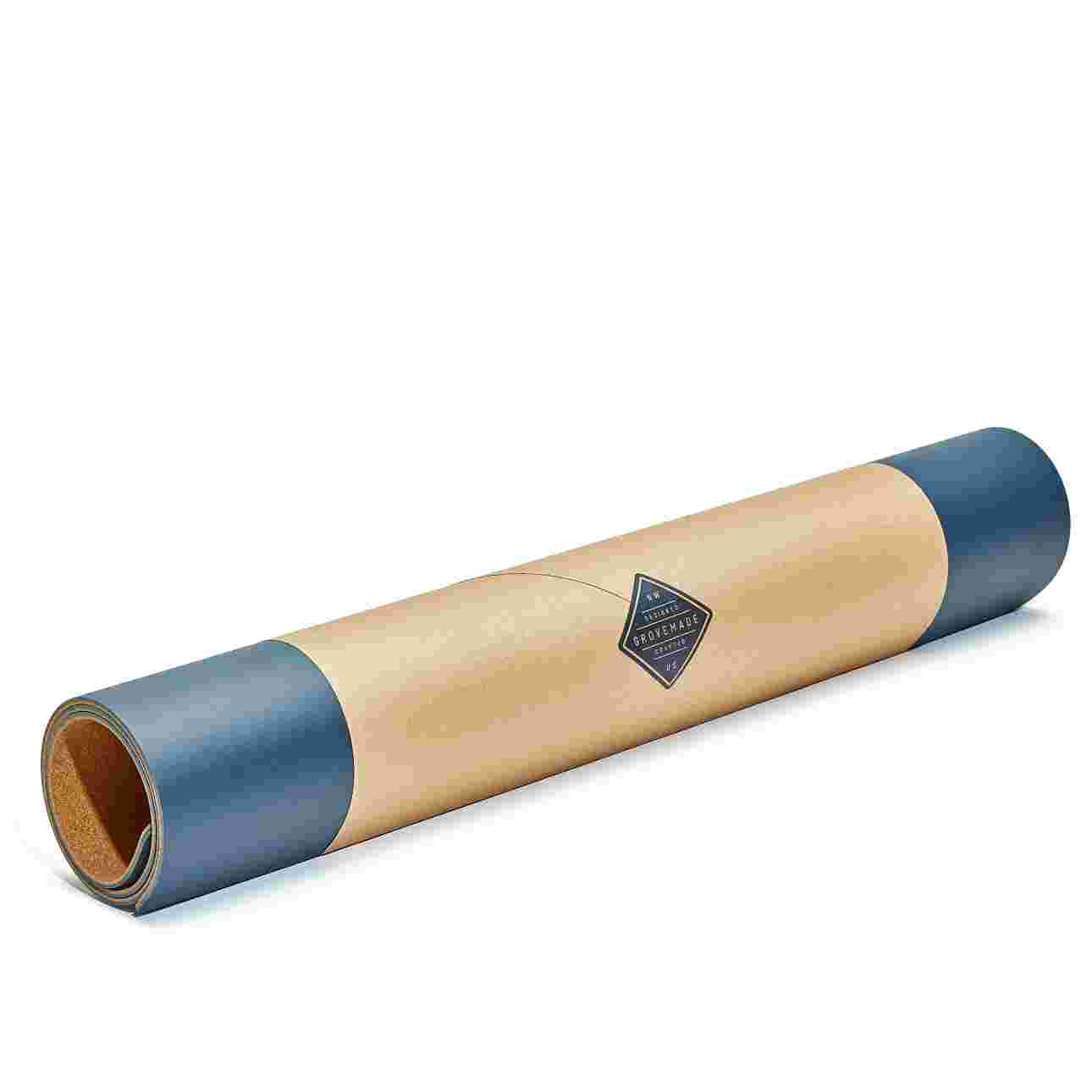 Extra large navy blue desk pad, rolled in brown craft paper for easy gifting.