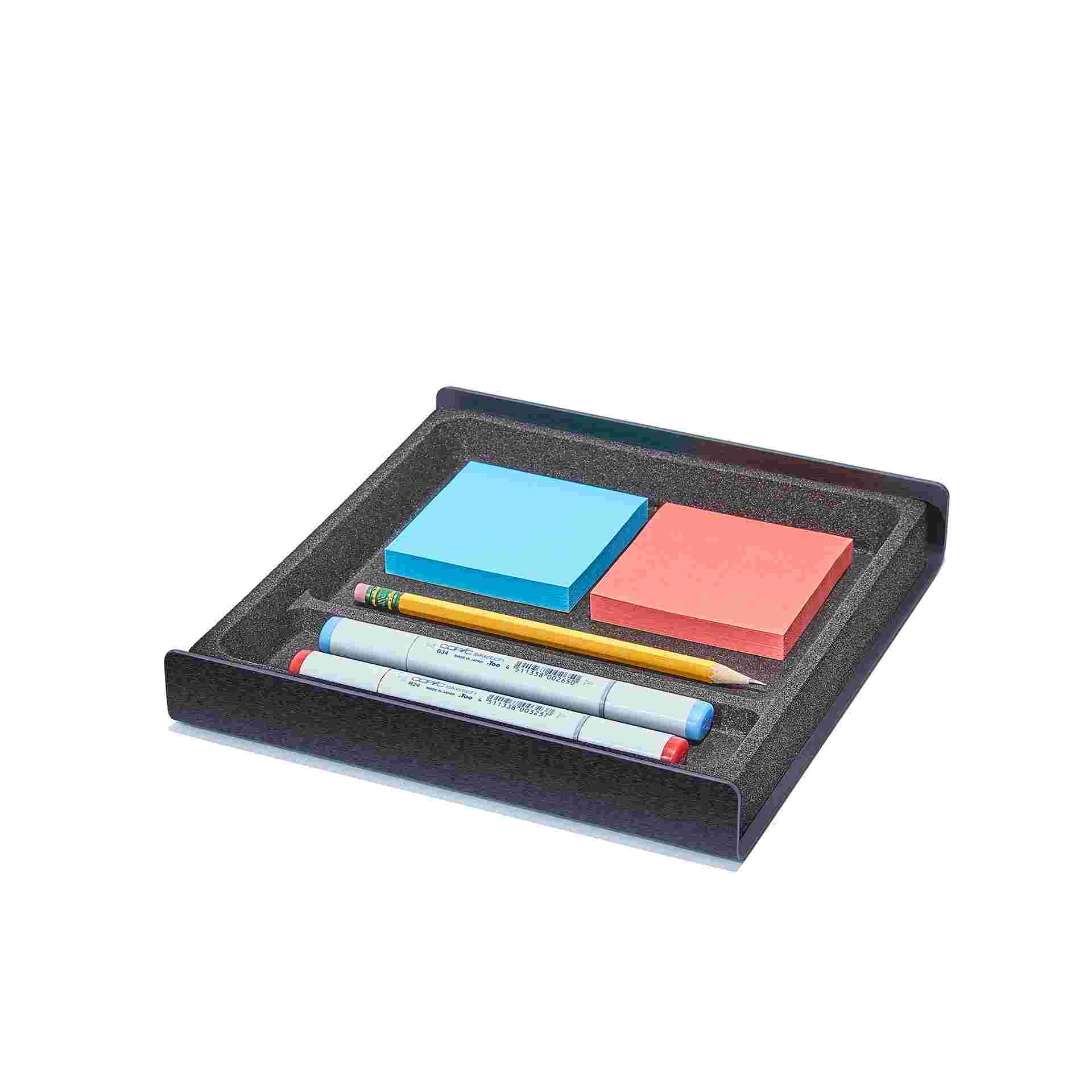 Medium all black cork desk tray holding tools and sticky notes.