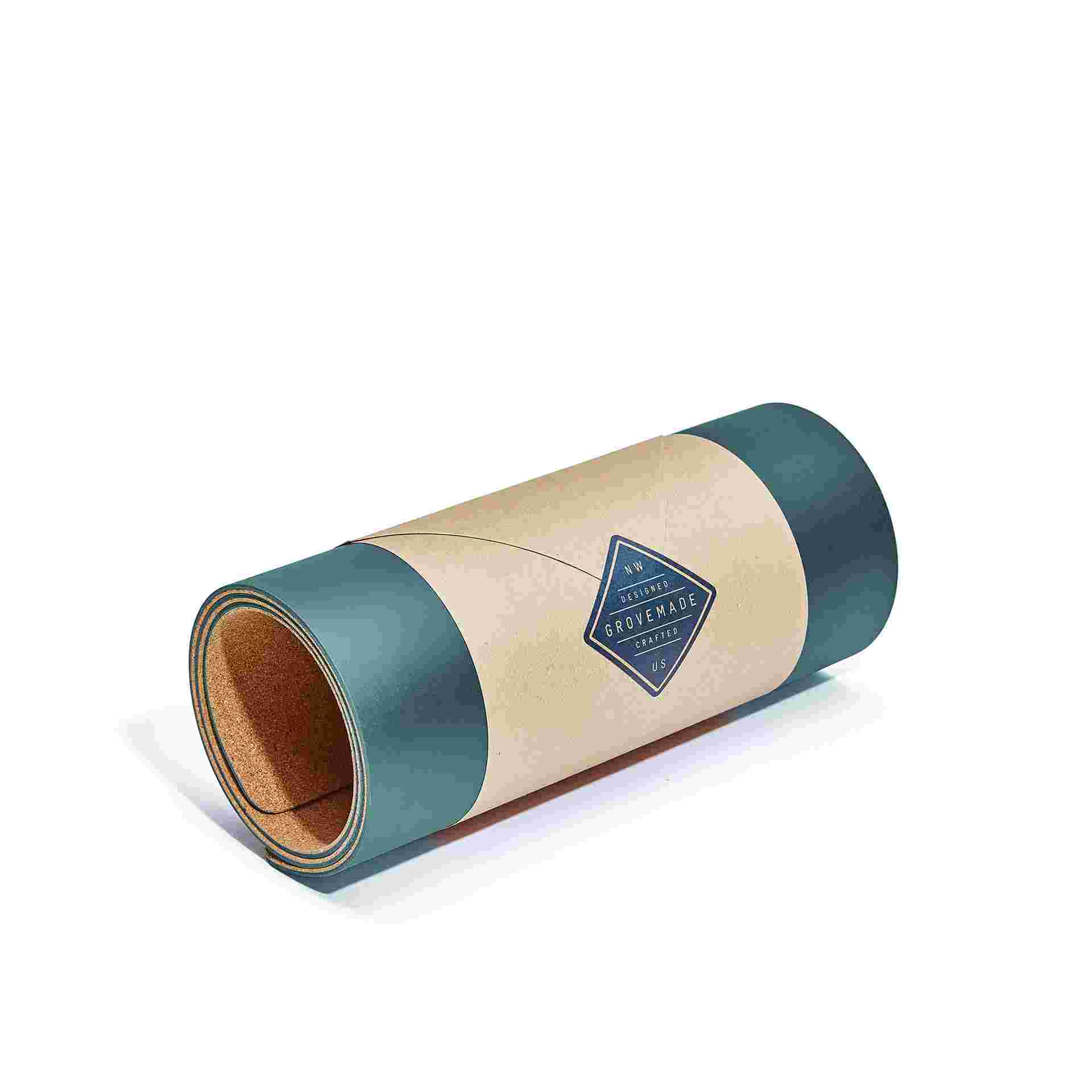 Conifer green desk pad wrapped in craft paper.