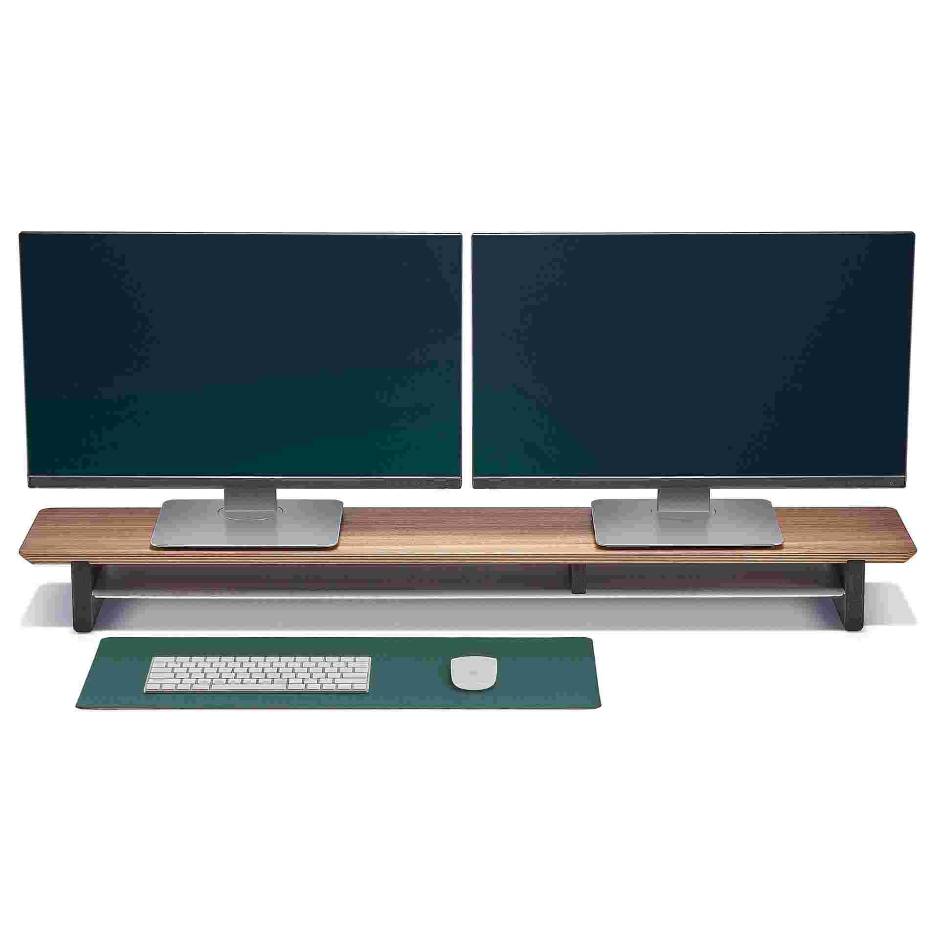 The small Conifer green desk pad in use with walnut desk shelf.