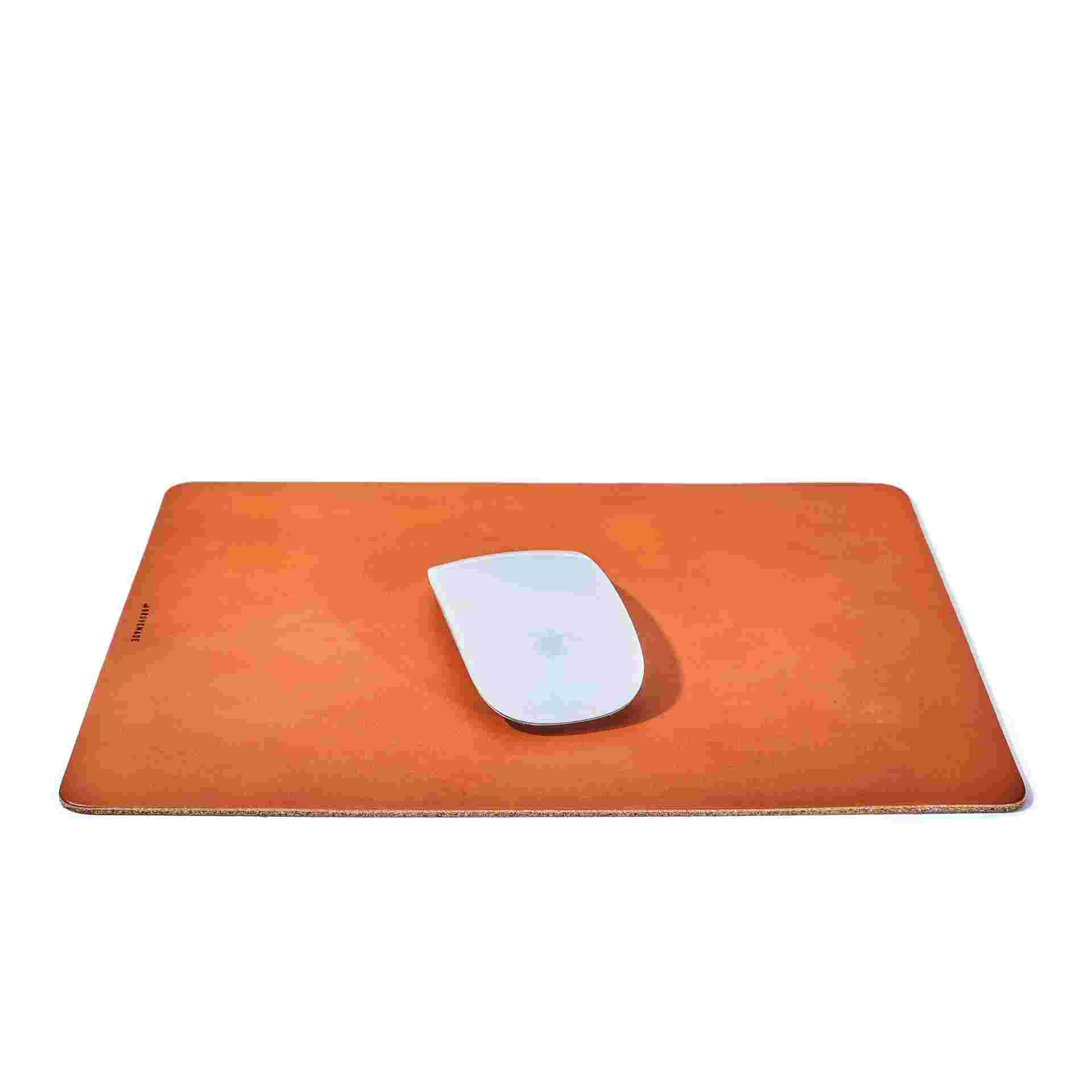 Premium tan leather mouse pad, measuring 9 inches by 11.25 inches.
