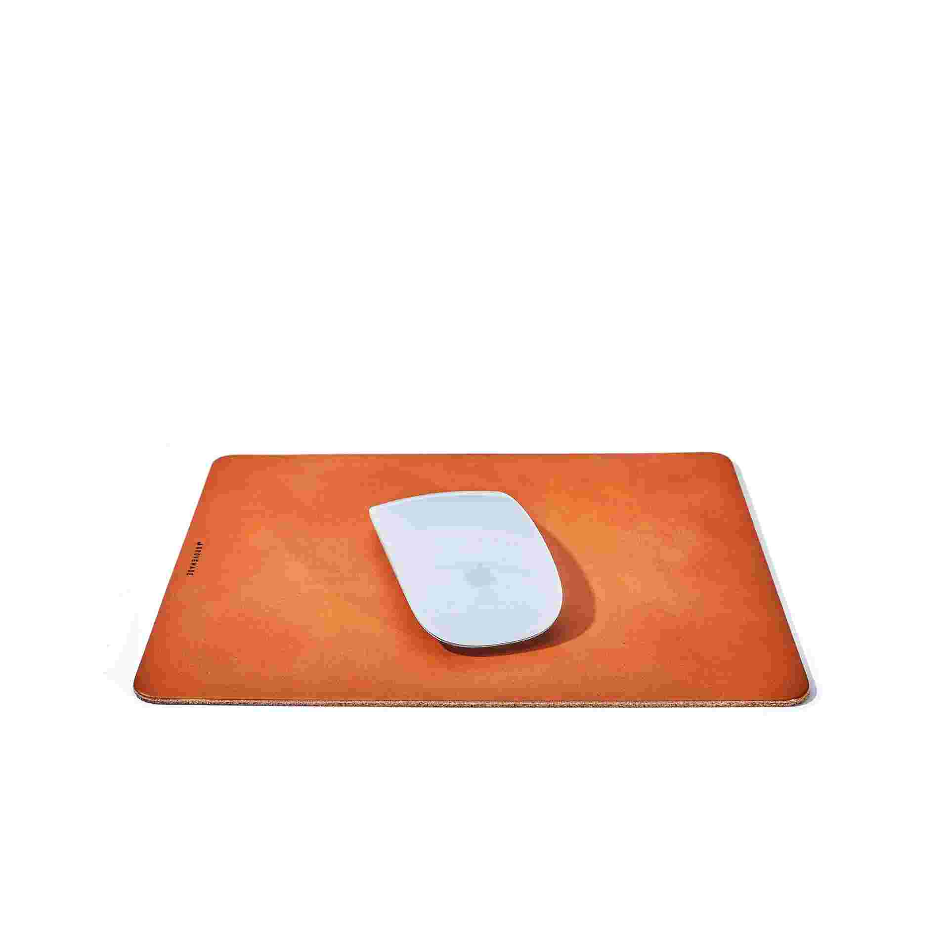 Premium tan leather mouse pad, measuring 7.5 inches by 9 inches.