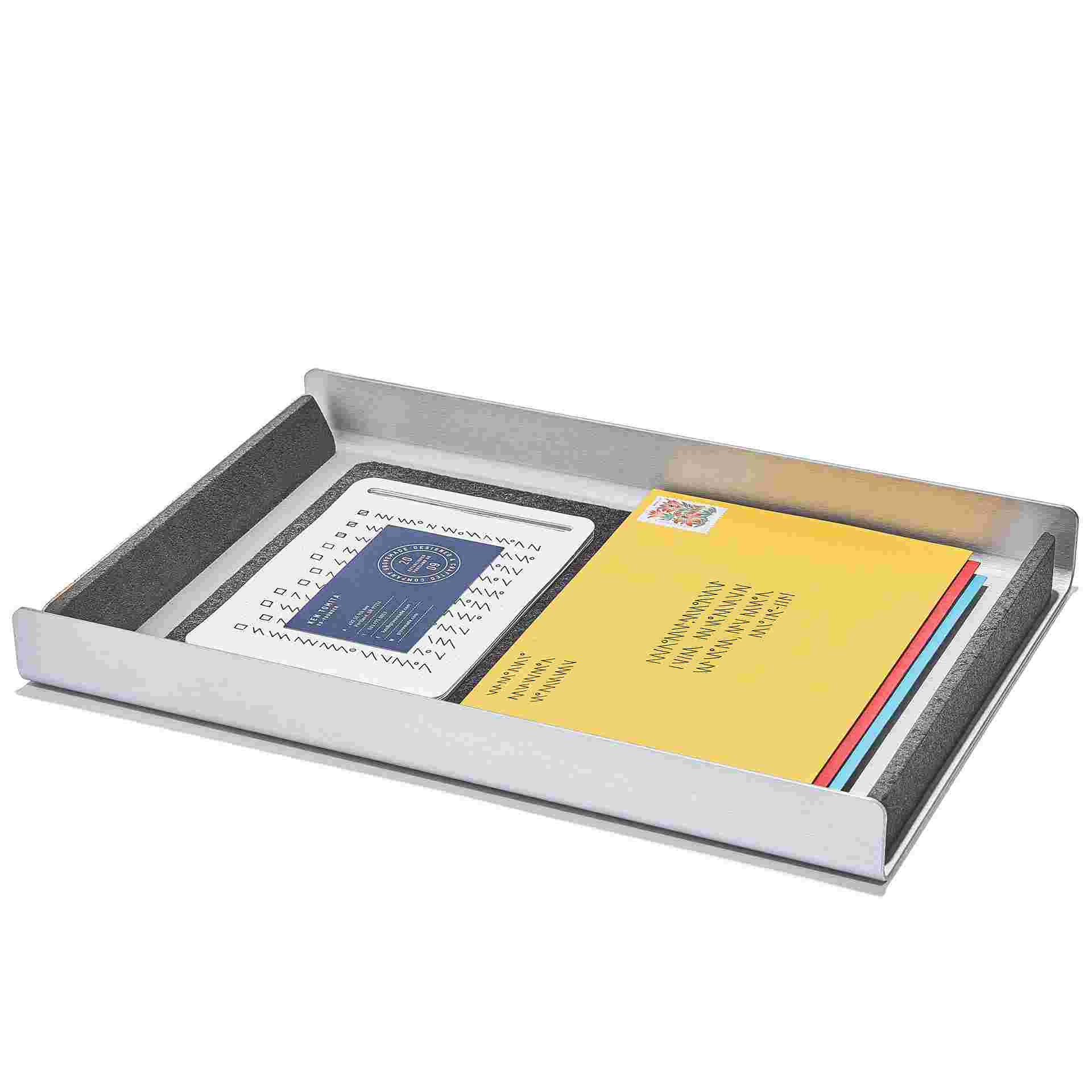 Dark paper tray with miscellaneous letters and notes.
