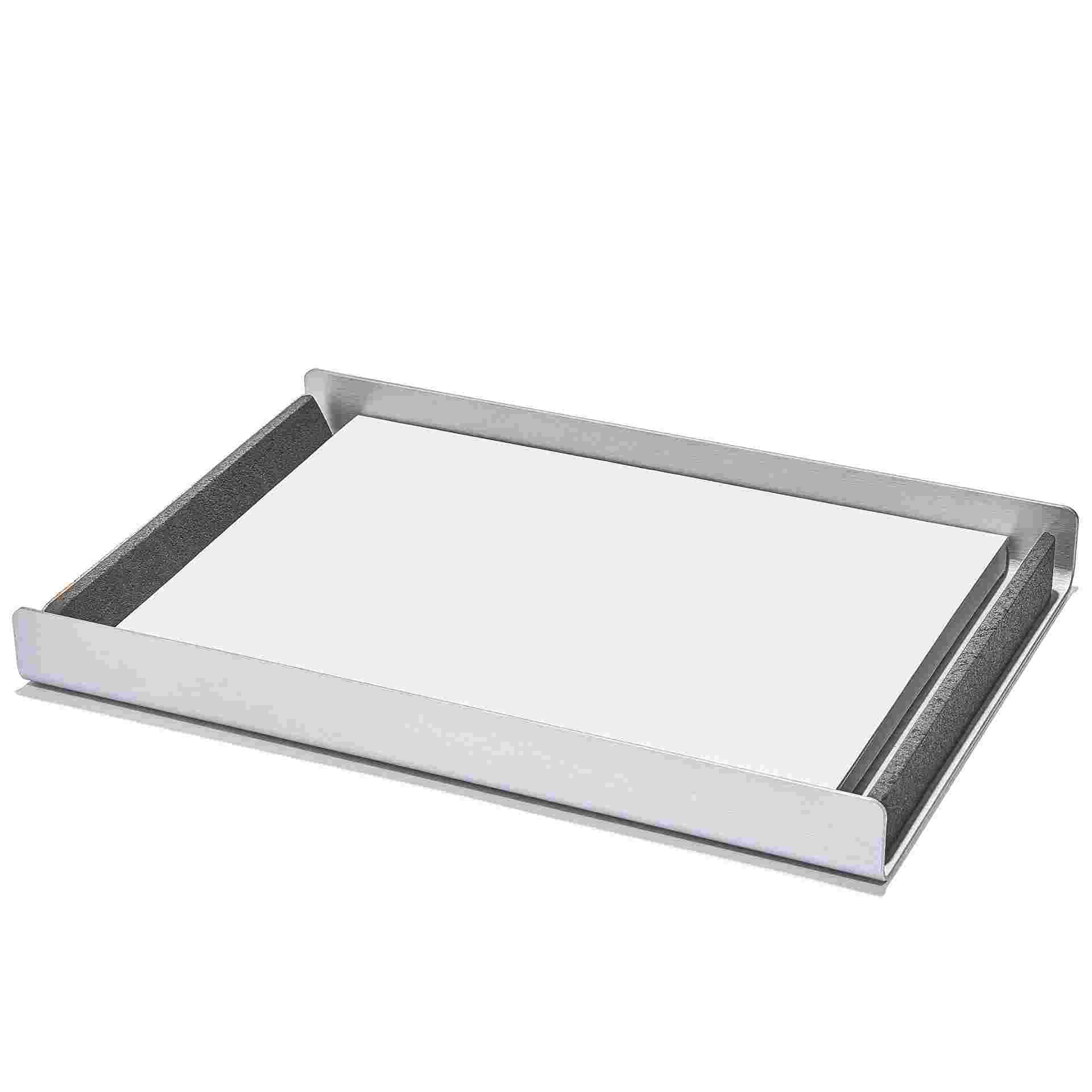 Dark paper tray full of 8.5 by 11 inch paper.