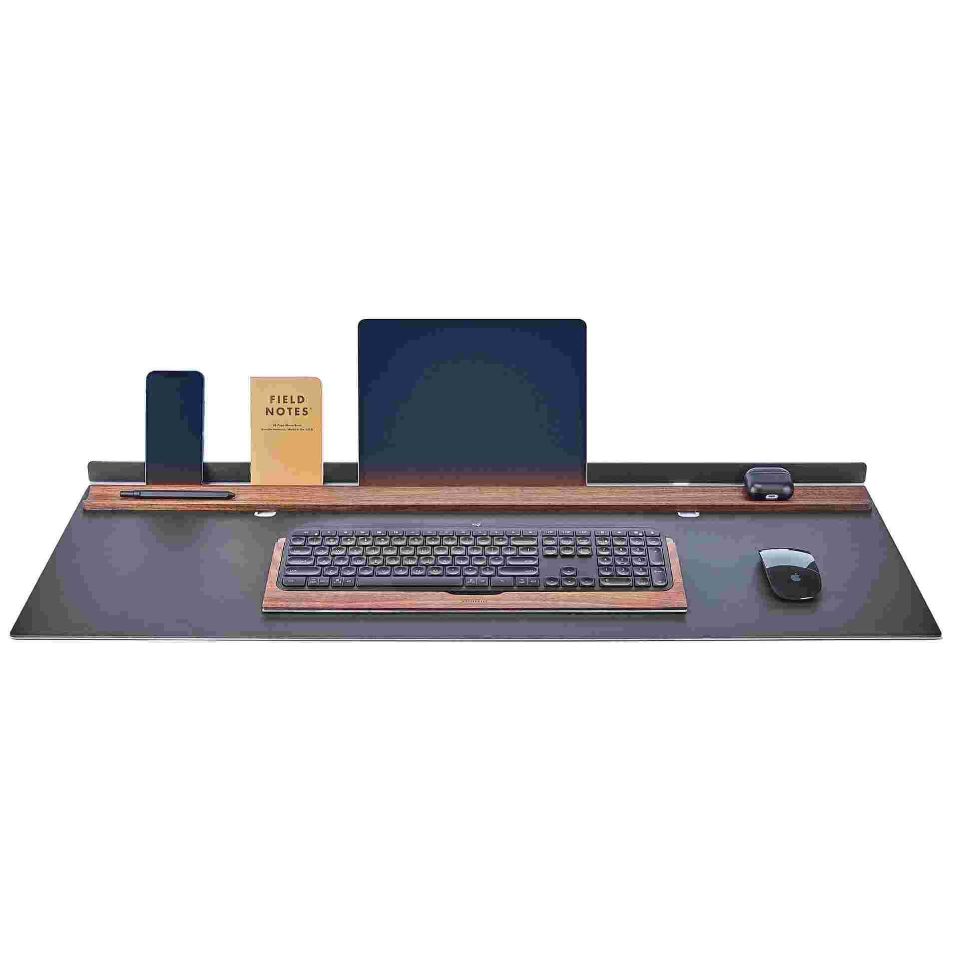 Grovemade matte black studio desk pad with large iPad and iPhone in display position and matching walnut keyboard tray.