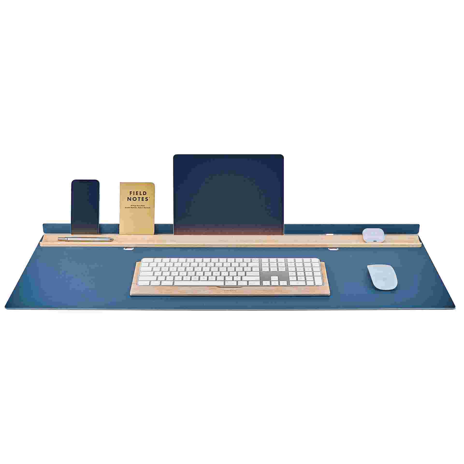 Grovemade matte blue studio desk pad with large iPad and iPhone in display position and matching maple keyboard tray.