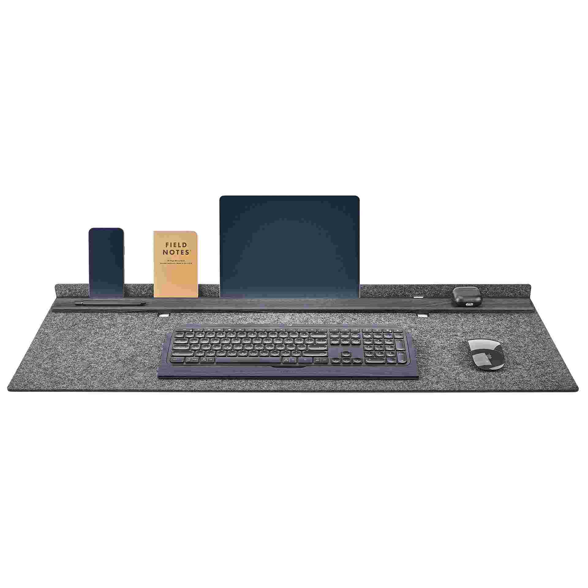 Grovemade blackened walnut felt studio desk pad with large iPad and iPhone in display position and matching blackened keyboard tray.