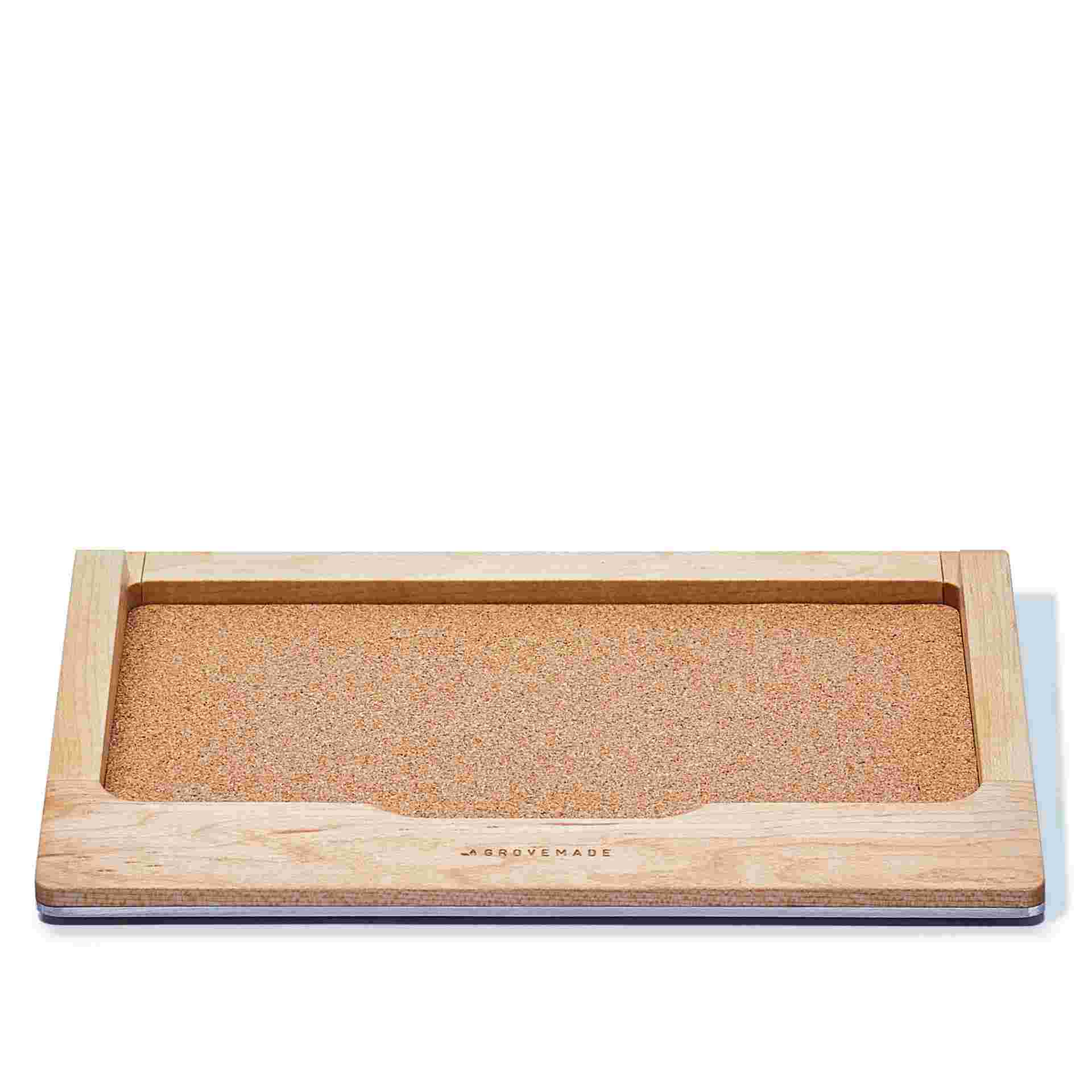 Maple trackpad tray with device removed, showing cork lining.
