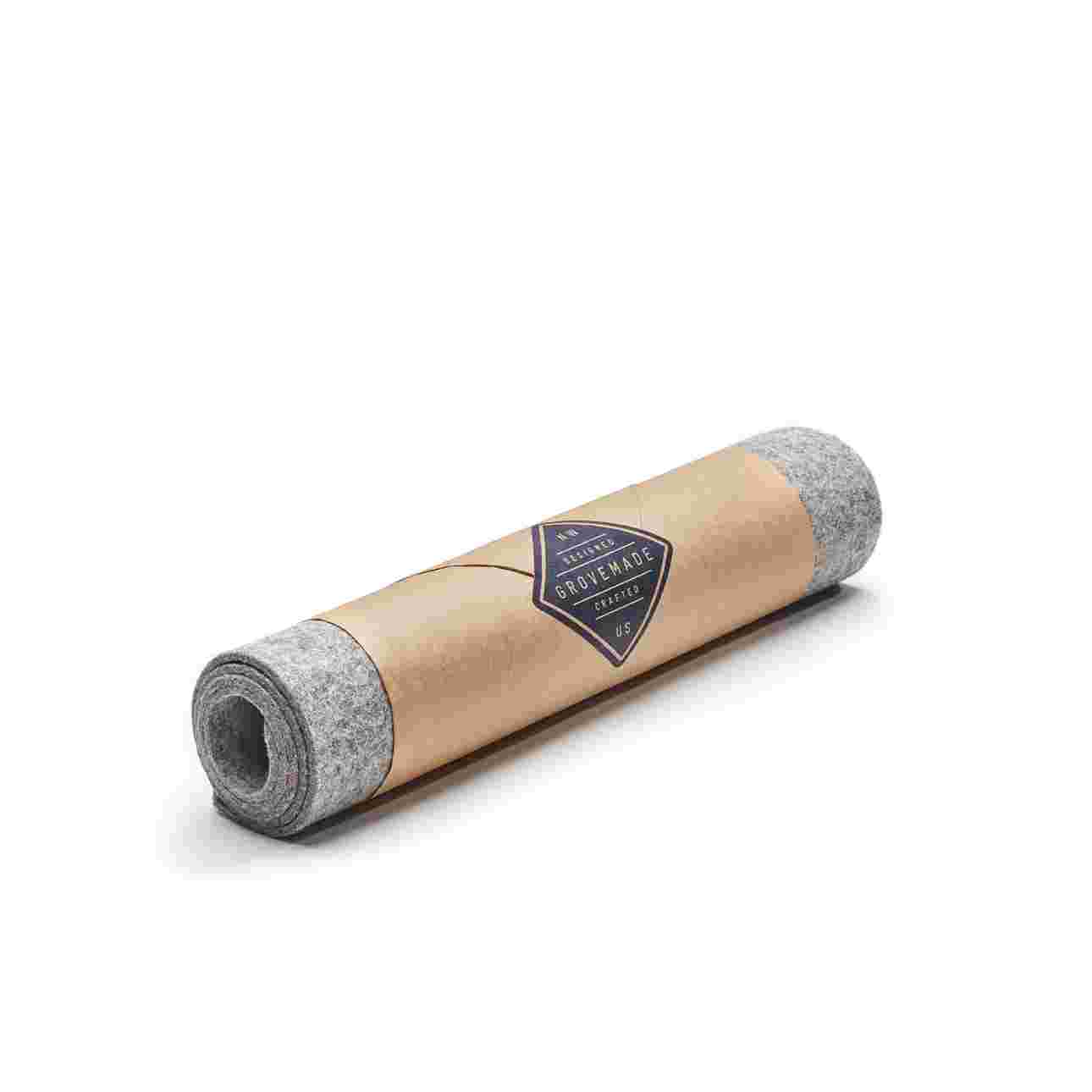The Medium Plus Wool Felt Desk Pad in light grey, wrapped and ready to gift.