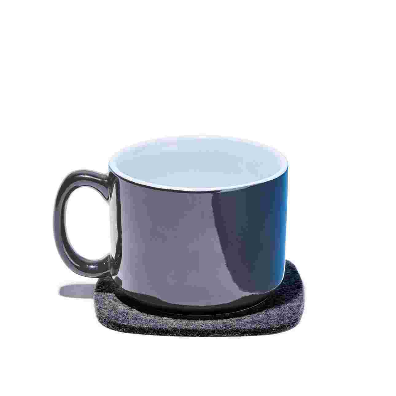 Premium Dark Wool Felt Coaster with hot beverage.