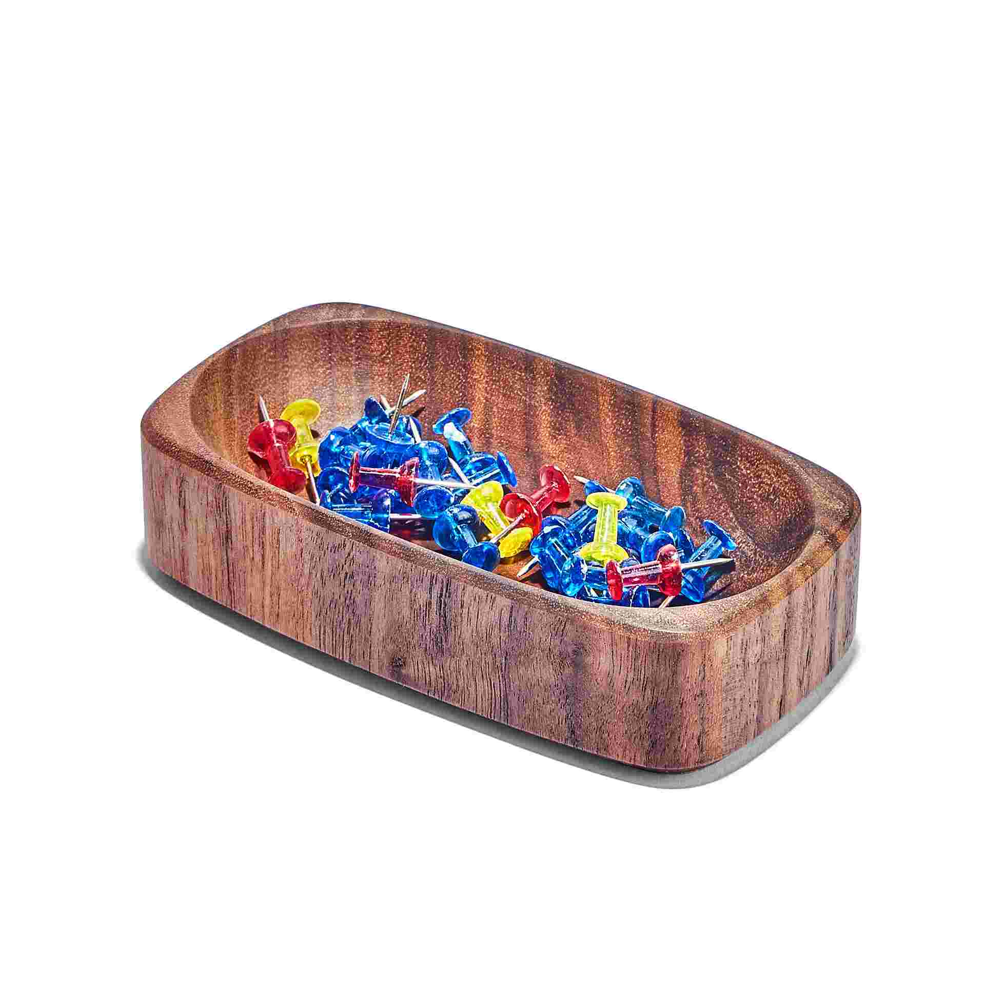 Wide walnut dish holding push pins.