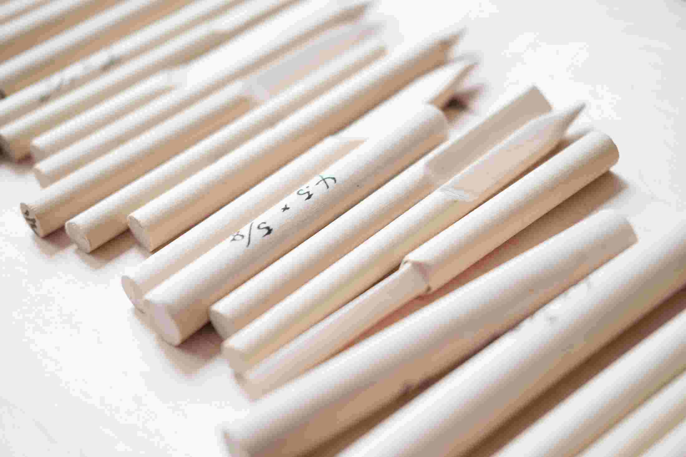 Wooden prototypes of early versions of the pen.