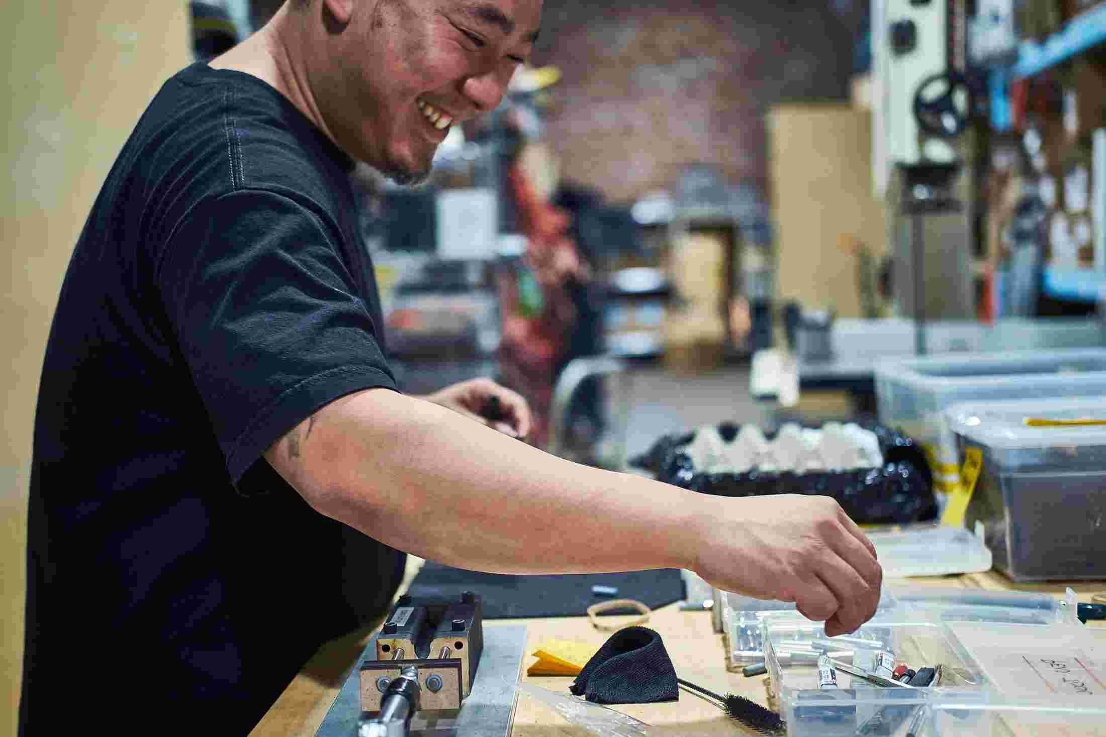 Production manager Victor Nguyen doing final assembly on the Grovemade Pen.
