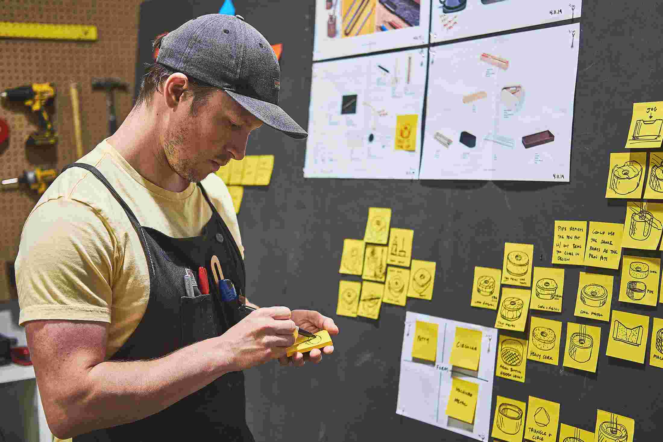 Lead product designer Sean Kelly sketching concepts for the pen stand.