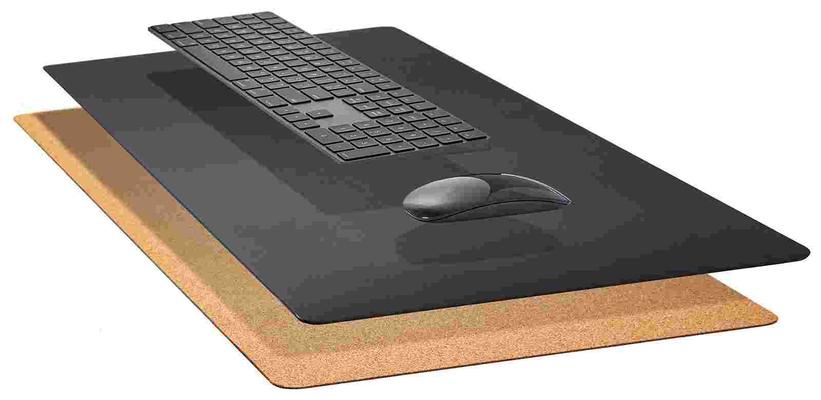 Exploded, cross-section view of the Matte Black Desk Pad showing the layering of cork and all-natural linoleum.
