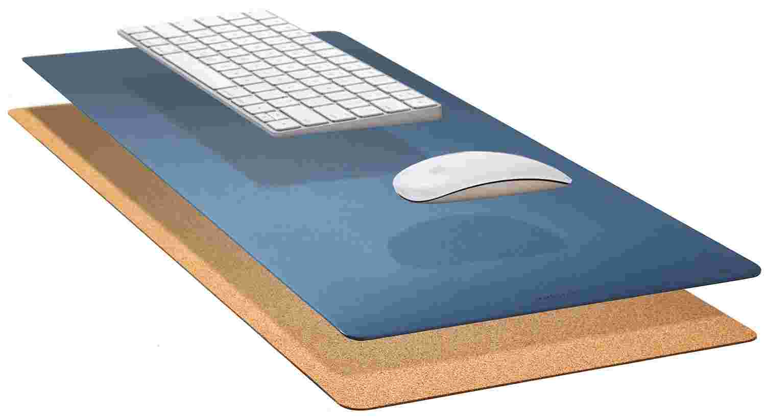 Exploded, cross-section view of the Matte Desk Pad in Navy Blue, showing the layering of cork and all-natural linoleum.
