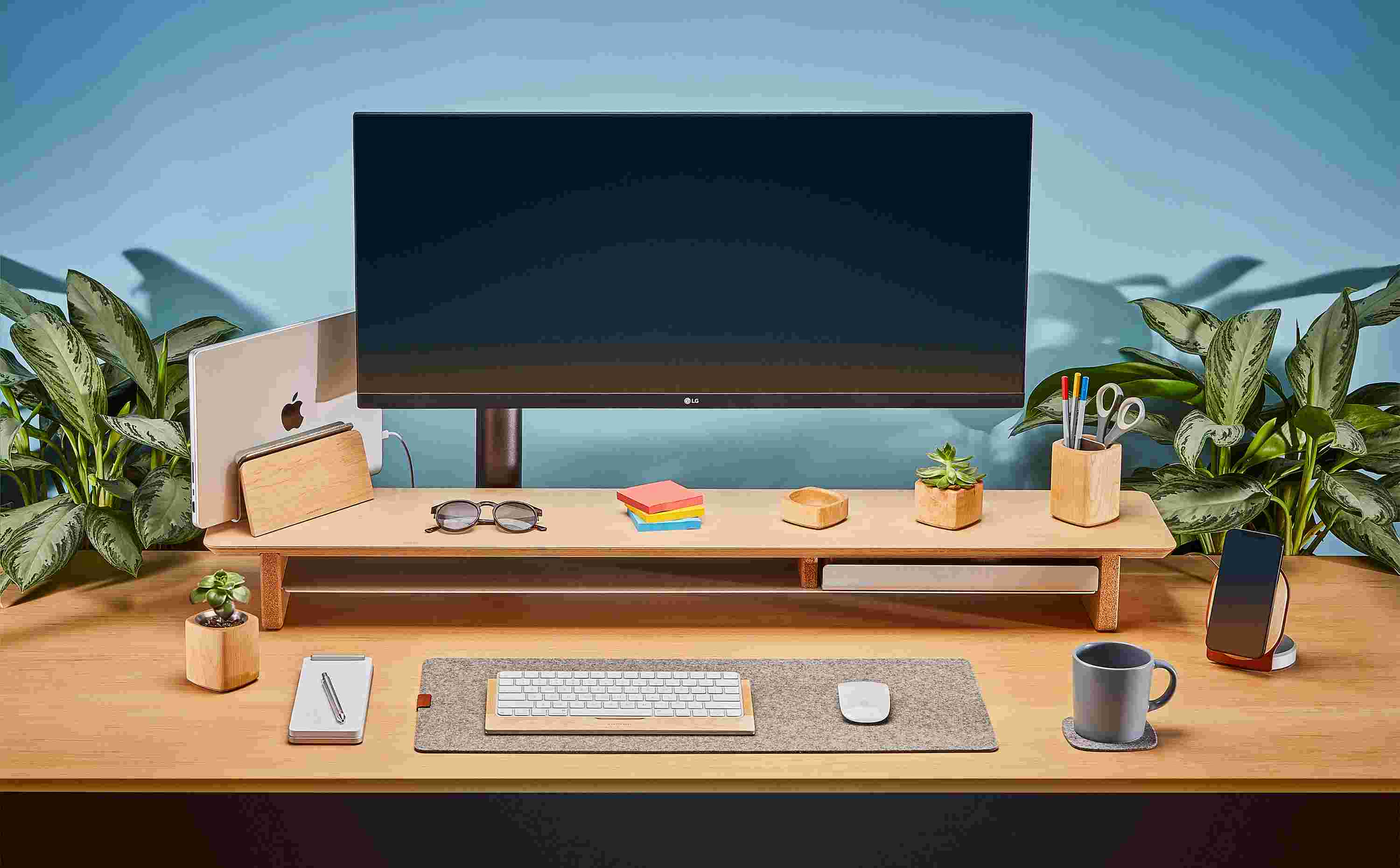 Large Maple Desk Shelf with ultra-wide monitor and matching Maple MacBook Dock.