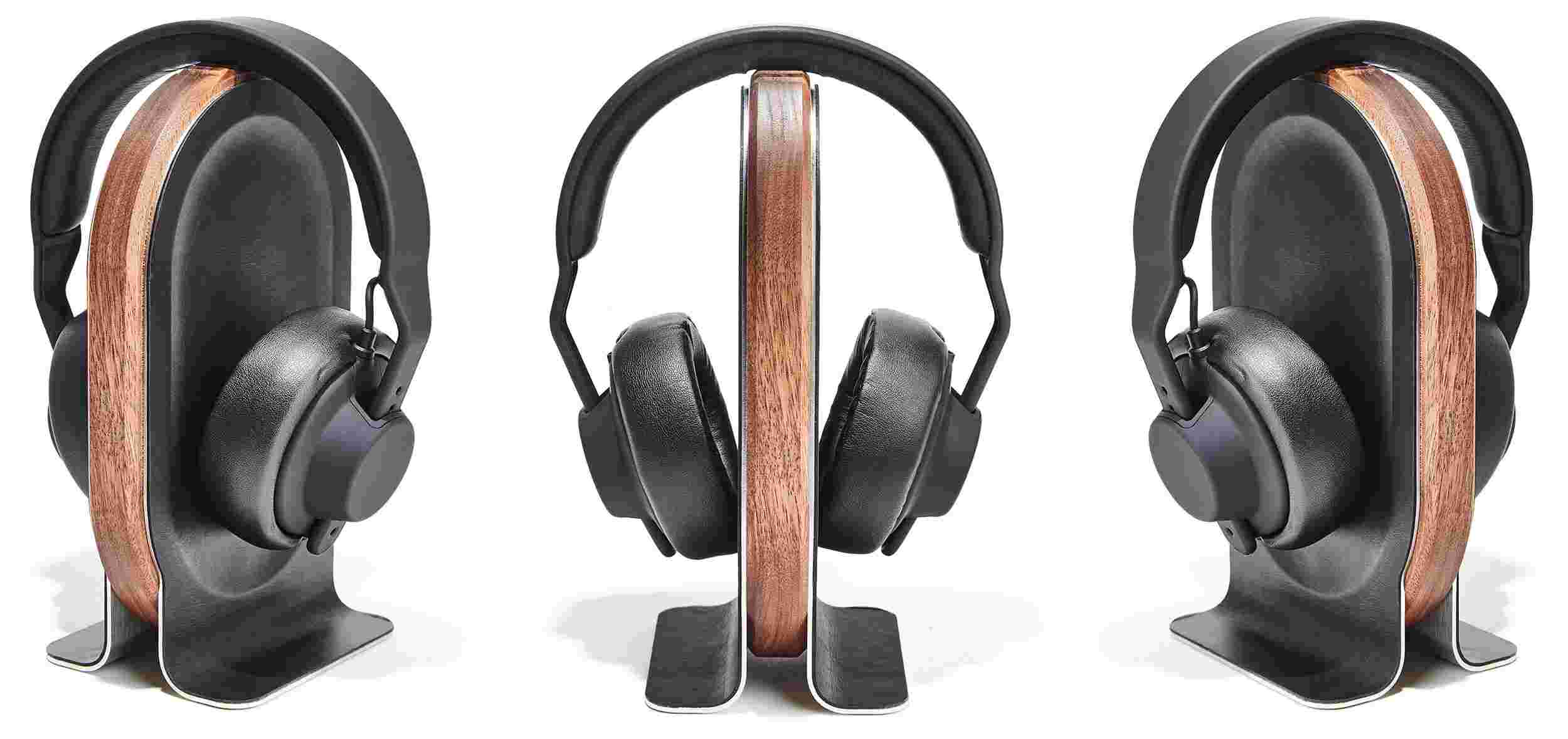 Rotating view of the walnut headphone stand with black over ear headphones.