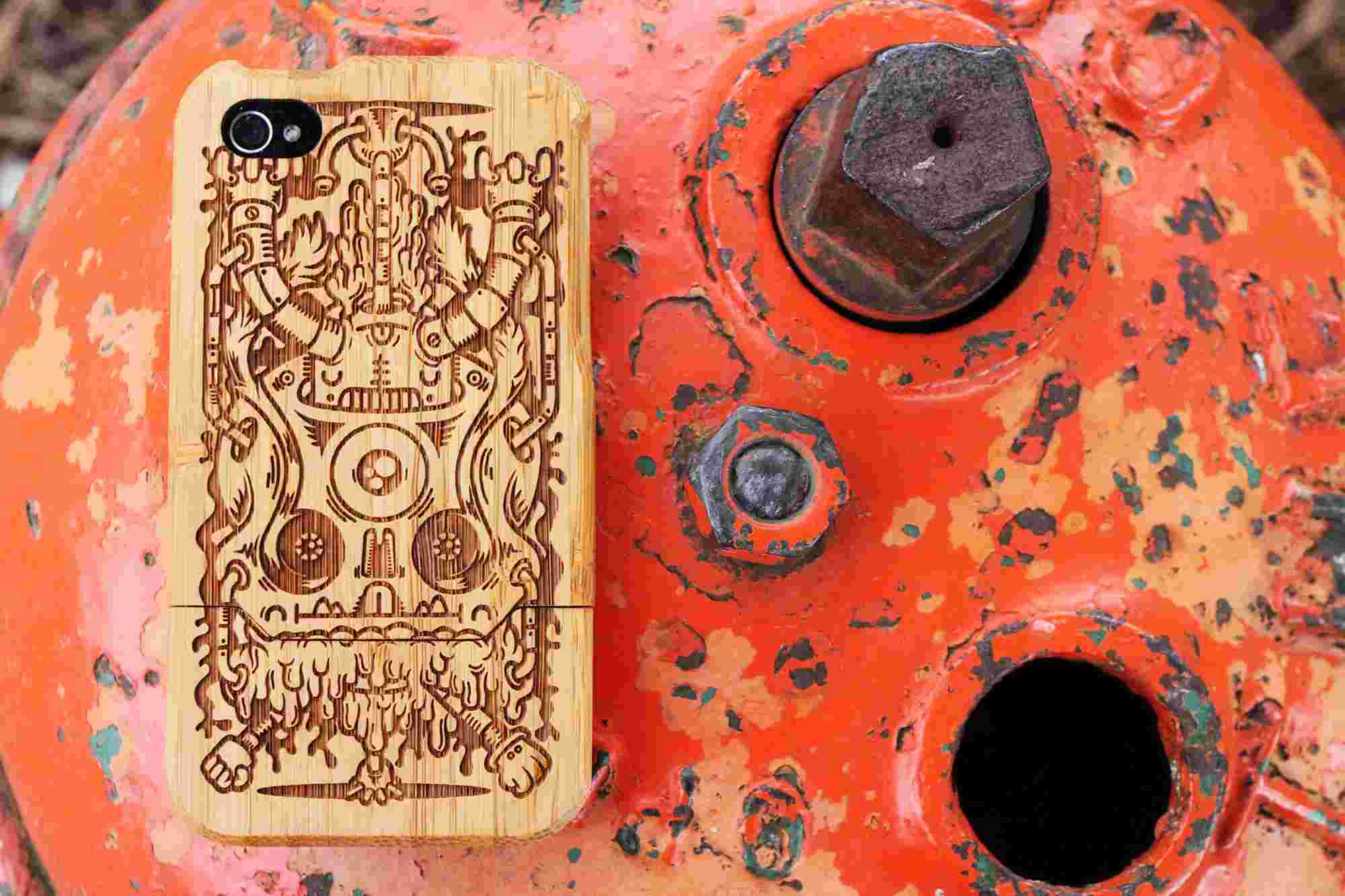 Detail of artist Add Fuel To The Fire's "Flipside" on the Grove Bamboo iPhone 4 case, photographed on a red fire hydrant.
