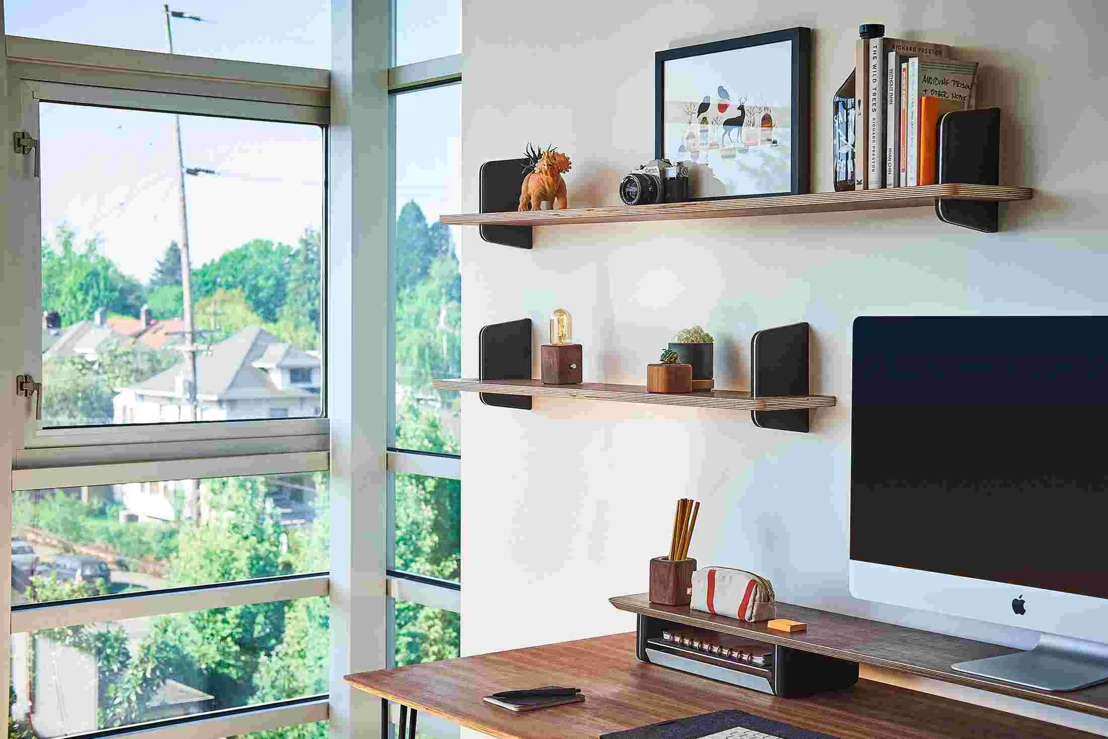 Walnut and cork wall shelves in two sizes, designed to mirror the Grovemade Desk Shelf.