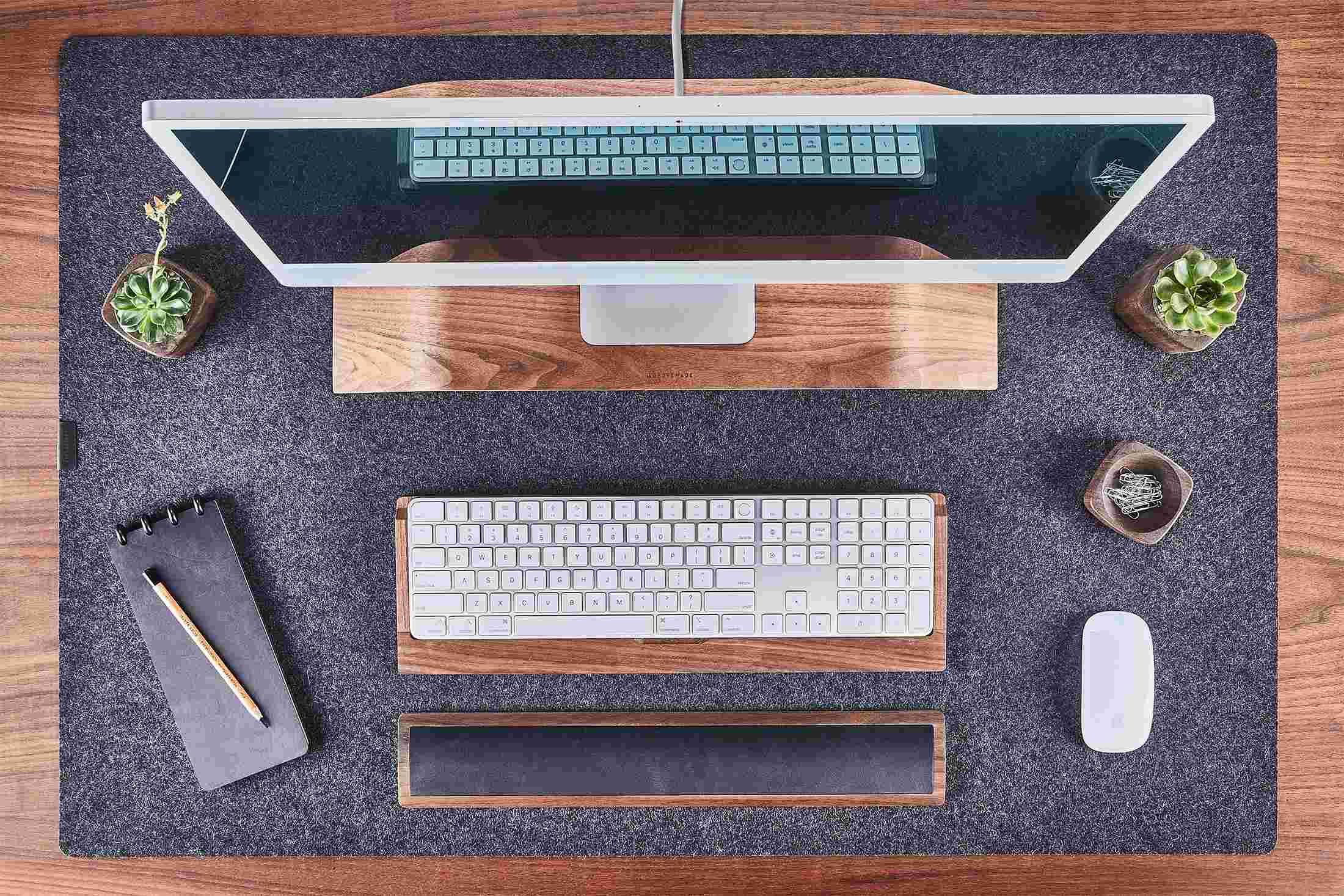 Overhead of the Walnut Desk Collection on the Large Wool Felt Desk Pad in Dark Grey.
