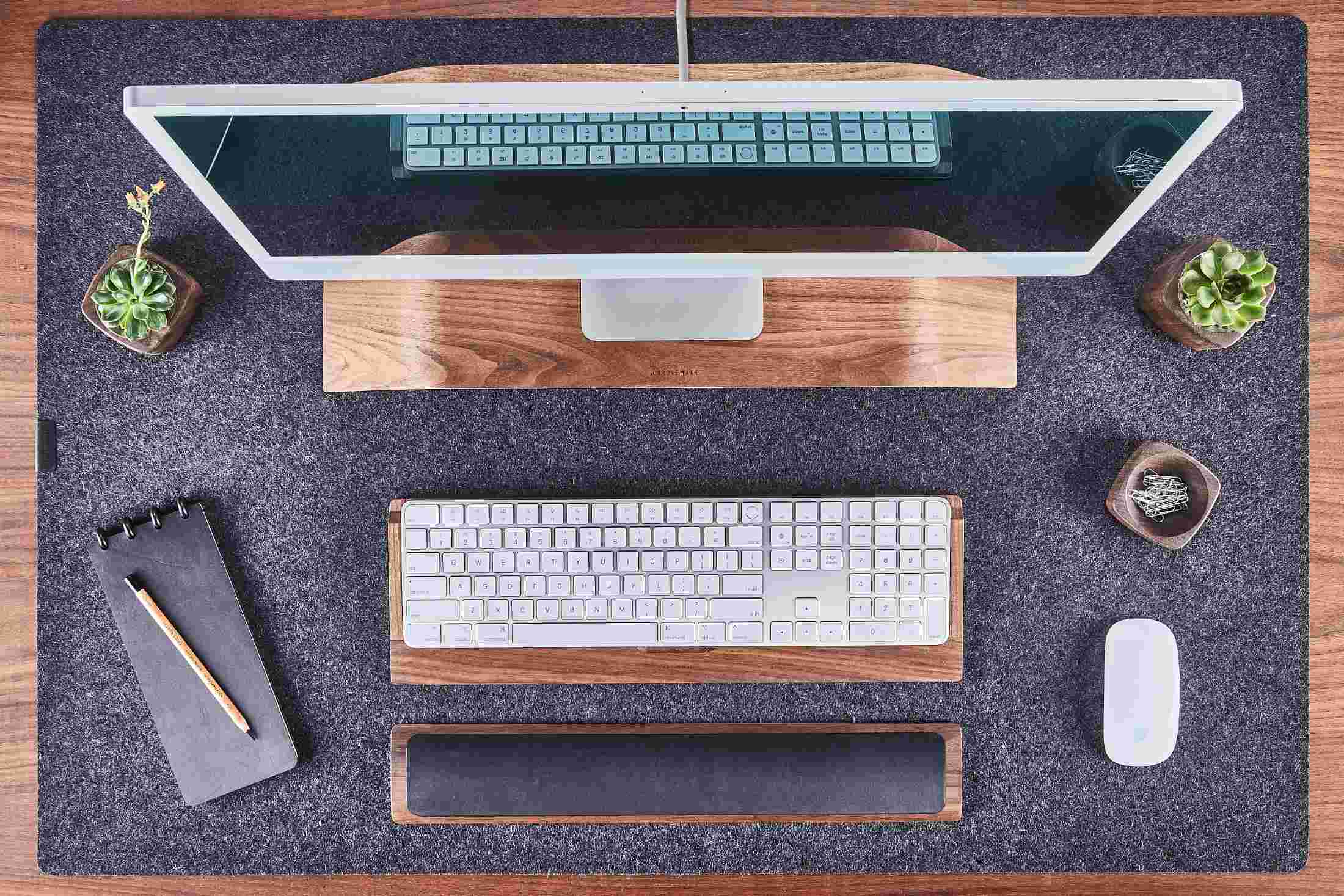 Walnut and dark leather wrist rest by Grovemade.