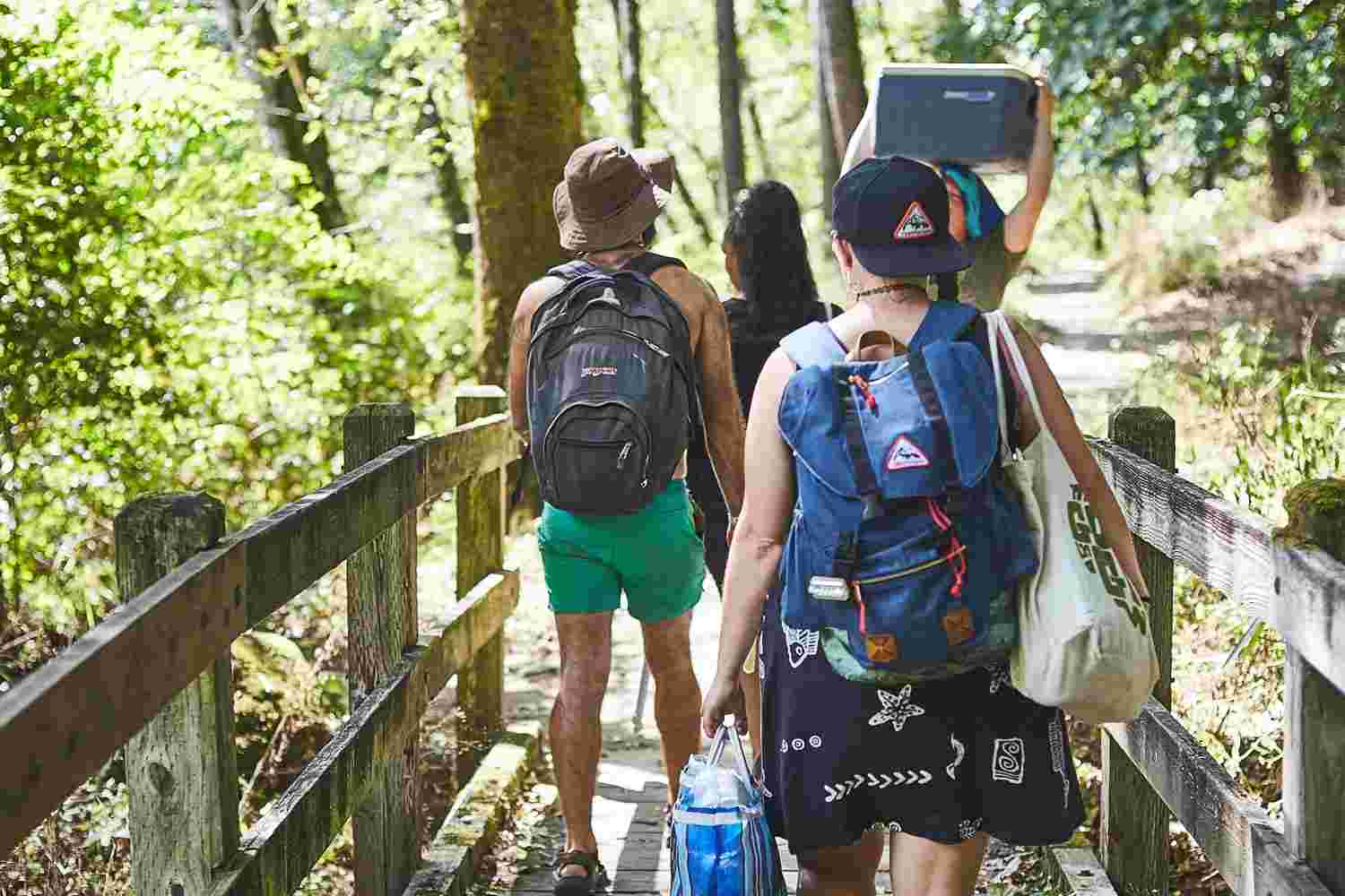 The Grovemade team on an outdoor offsite, carrying coolers and backpacks.