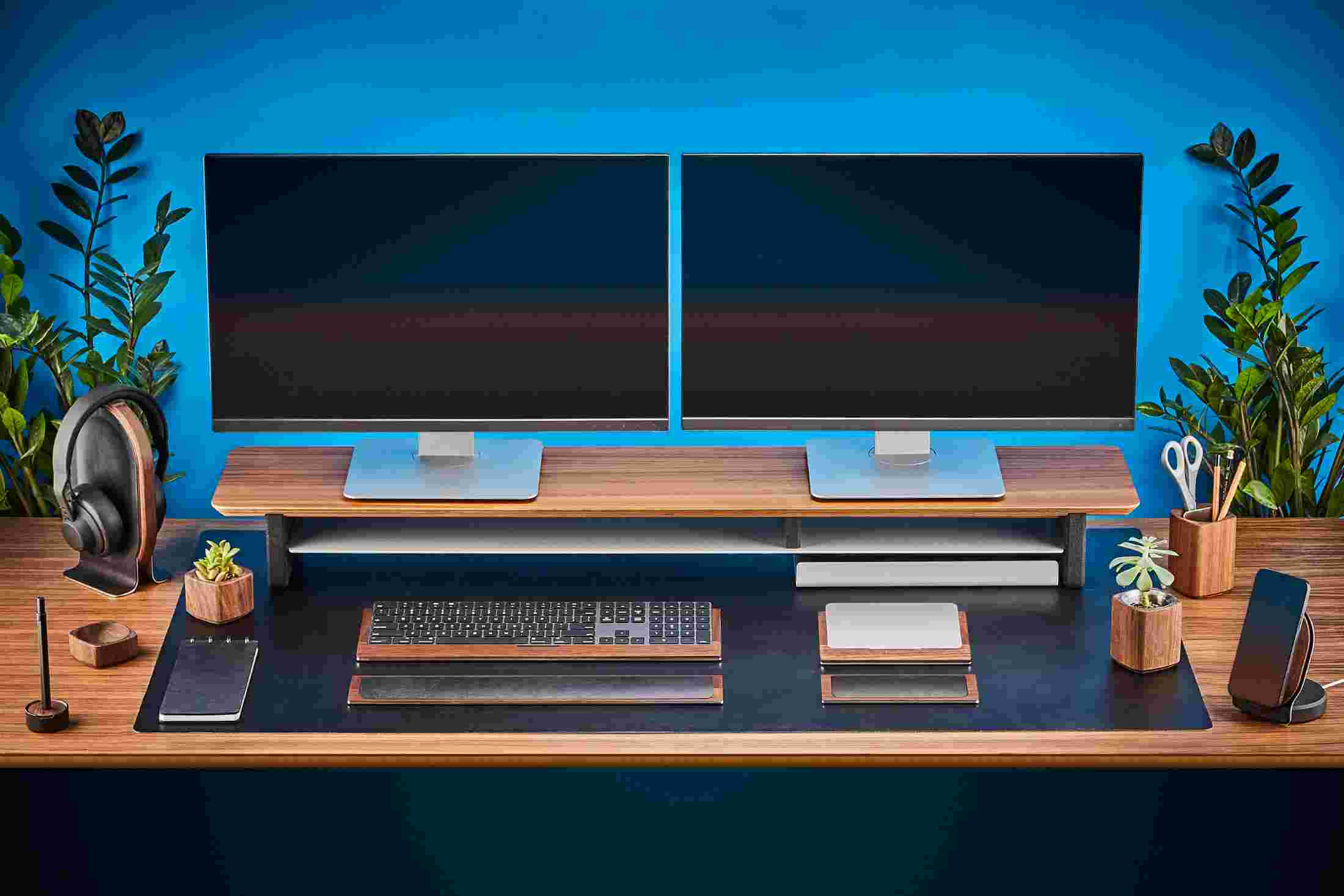 Front view of the Grovemade Walnut Desk Collection featuring the black leather wrist rest.