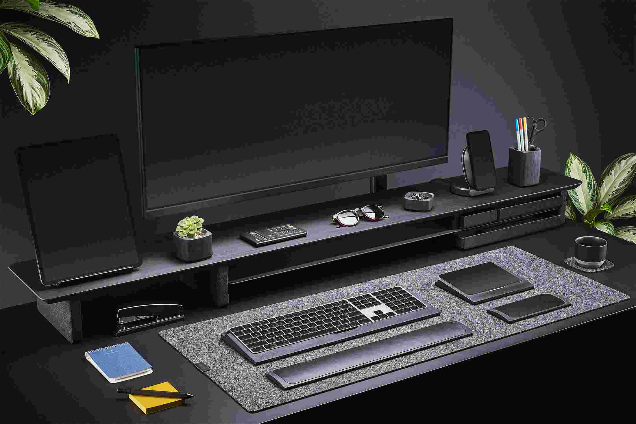 3/4 view of the XL Blackened Walnut Desk Shelf with matching black iPhone and iPad stands.