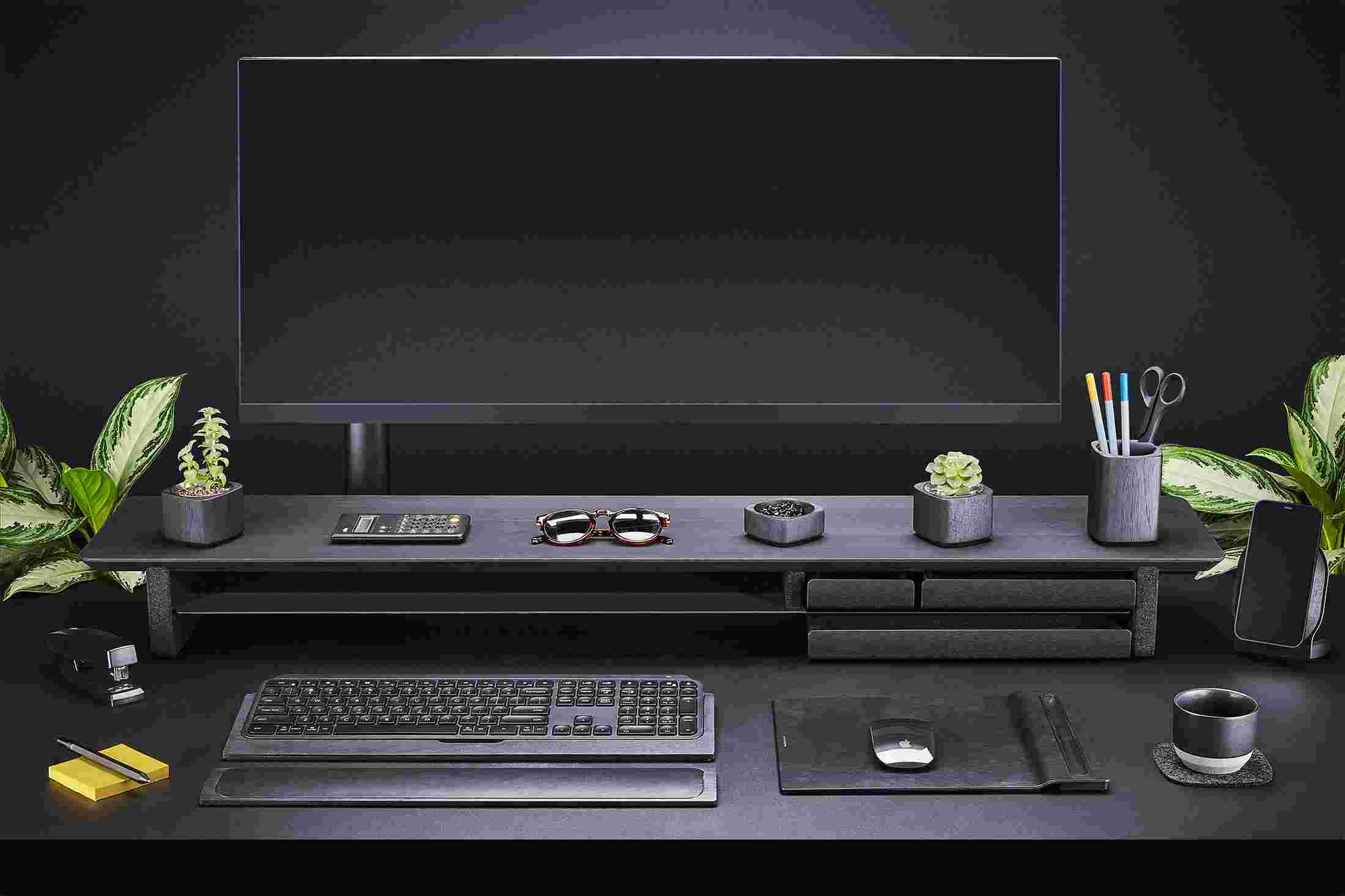 Front view of the entire All-Black Collection—Desk shelf, keyboard tray, wrist rest, mouse pad, iPhone stand and more.