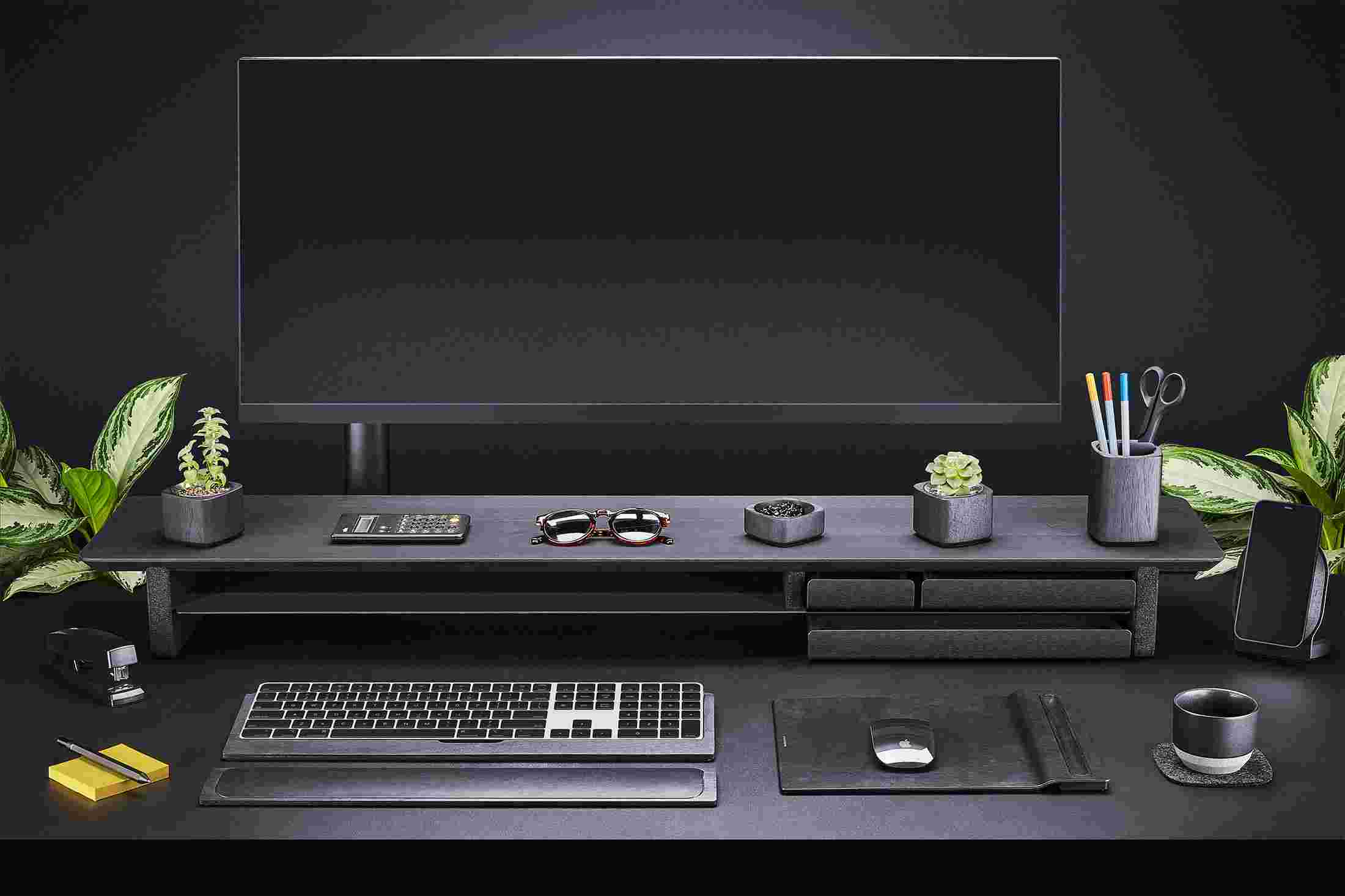 Front view of the entire All-Black Collection—Desk shelf, keyboard tray, wrist rest, mouse pad, iPhone stand and more.