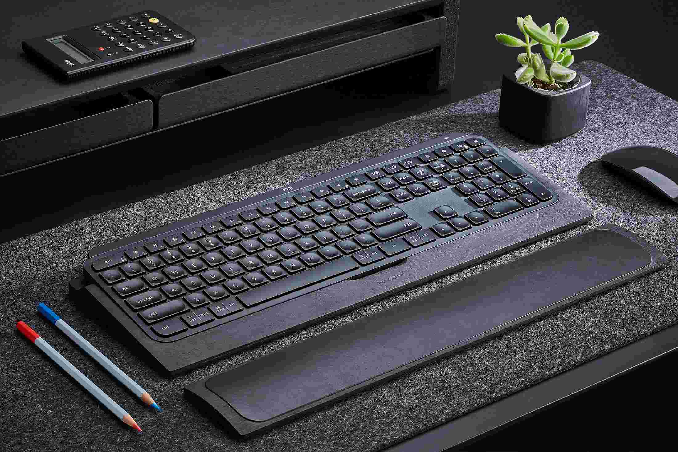 Detail of the Blackened Walnut MX Keys Keyboard Tray with matching wrist rest.