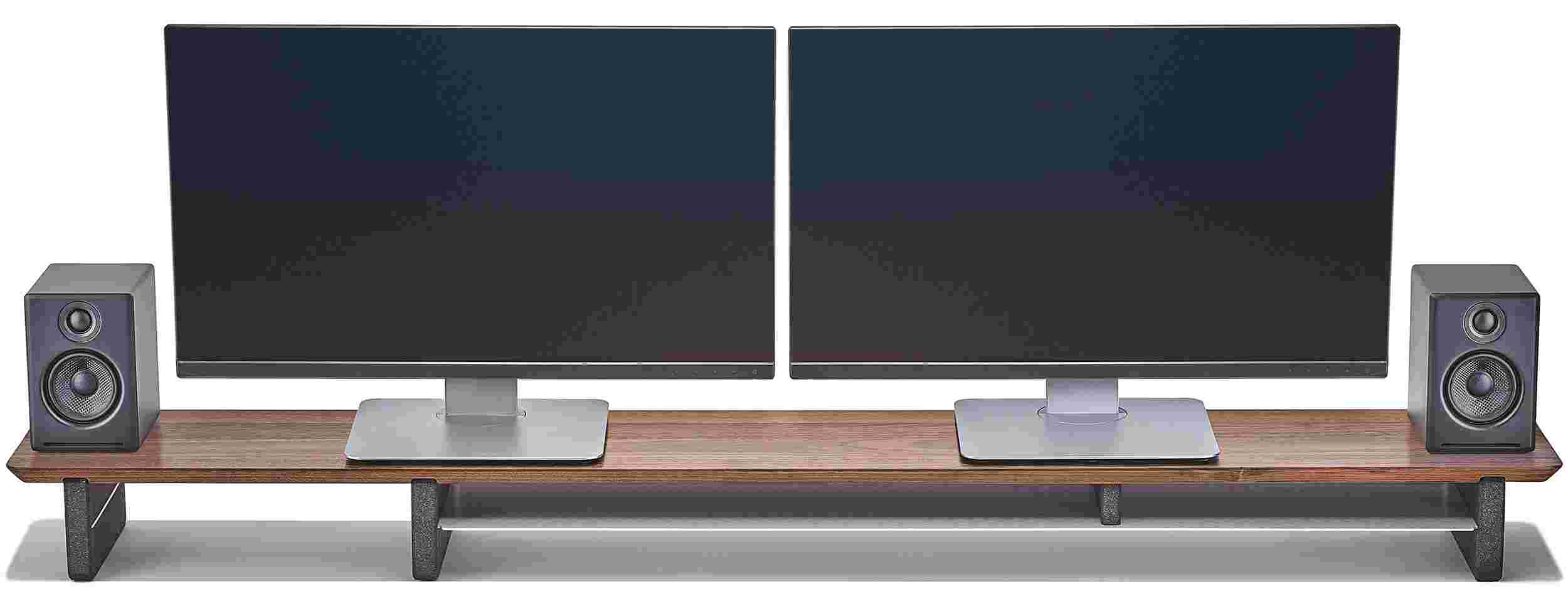 Extra large solid walnut wooden desk shelf with two computer monitors and two speakers on top.