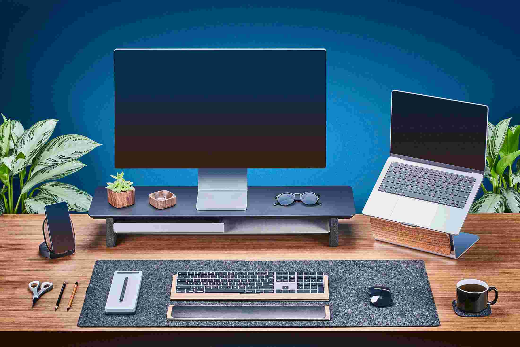 Medium Matte Black Monitor Stand with Apple Studio Display and laptop stand for MacBook.