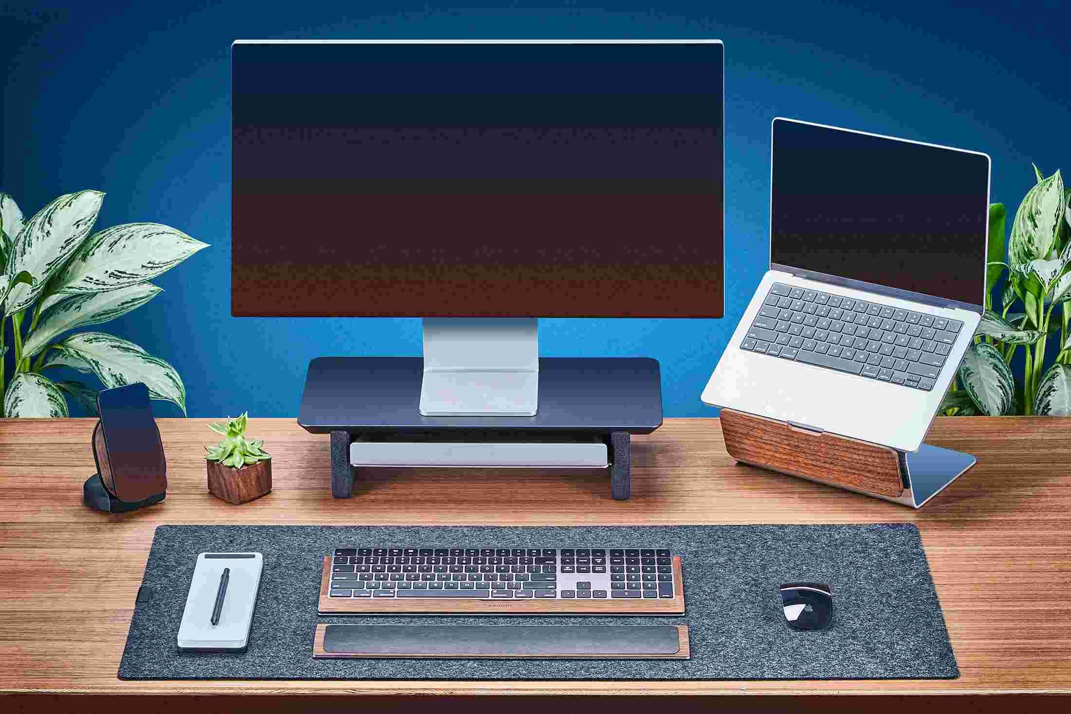 Small Matte Black Monitor Stand with Apple Studio Display and laptop stand for MacBook.