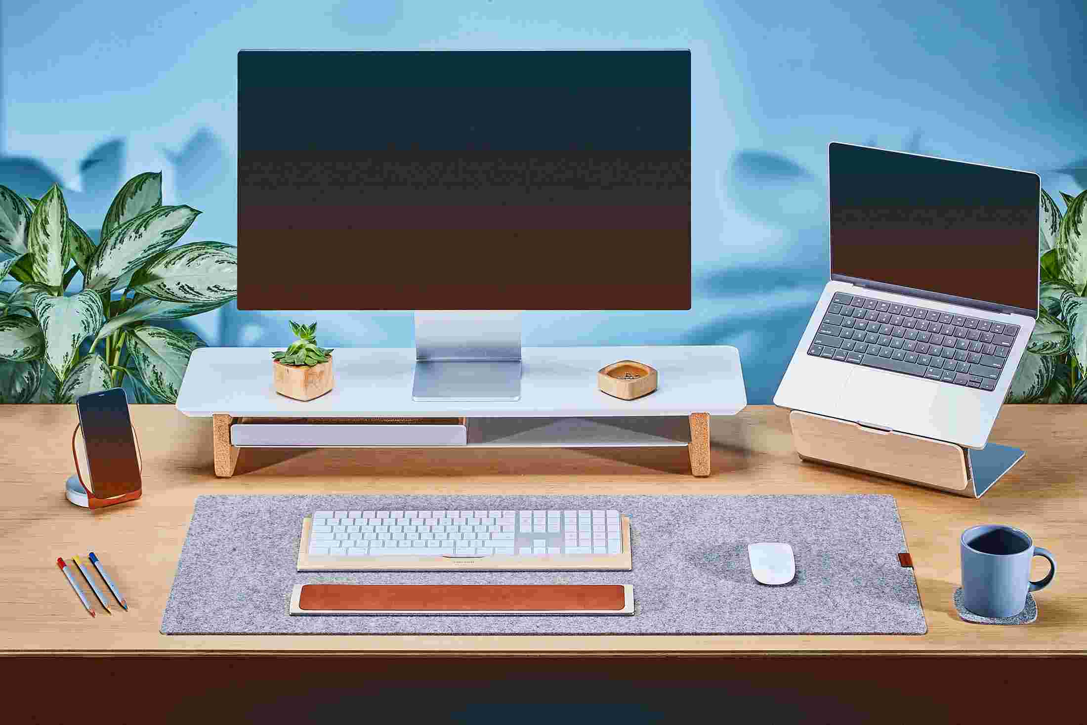 Medium Matte White Monitor Stand with Apple Studio Display and laptop stand for MacBook.