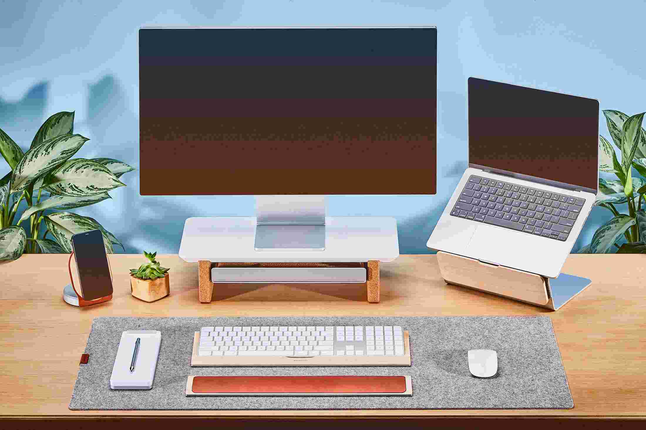 Small Matte White Monitor Stand with Apple Studio Display and laptop stand for MacBook.