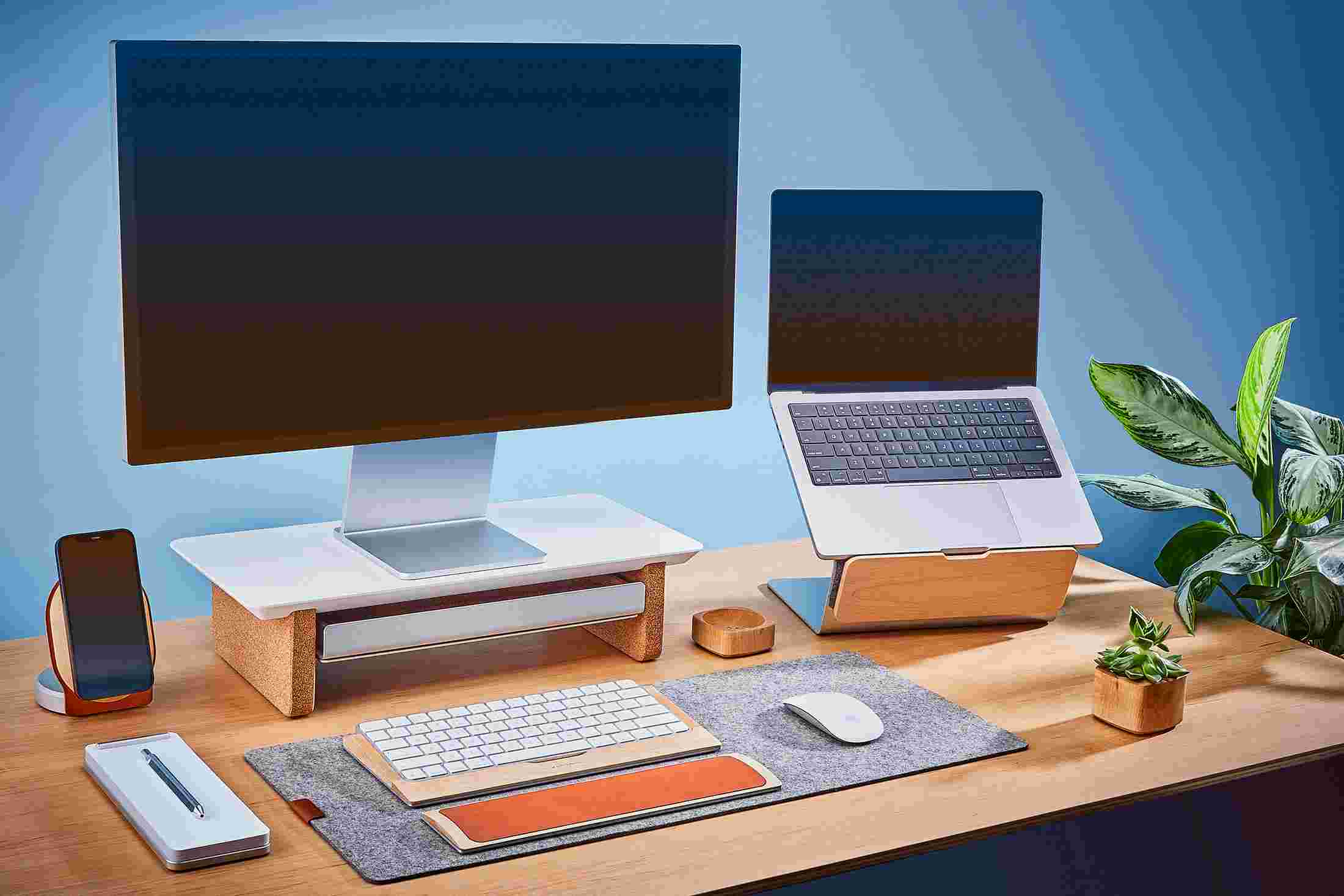 The small Matte White Desk Shelf and Laptop Riser for small desktops, paired with small wool felt desk pad.