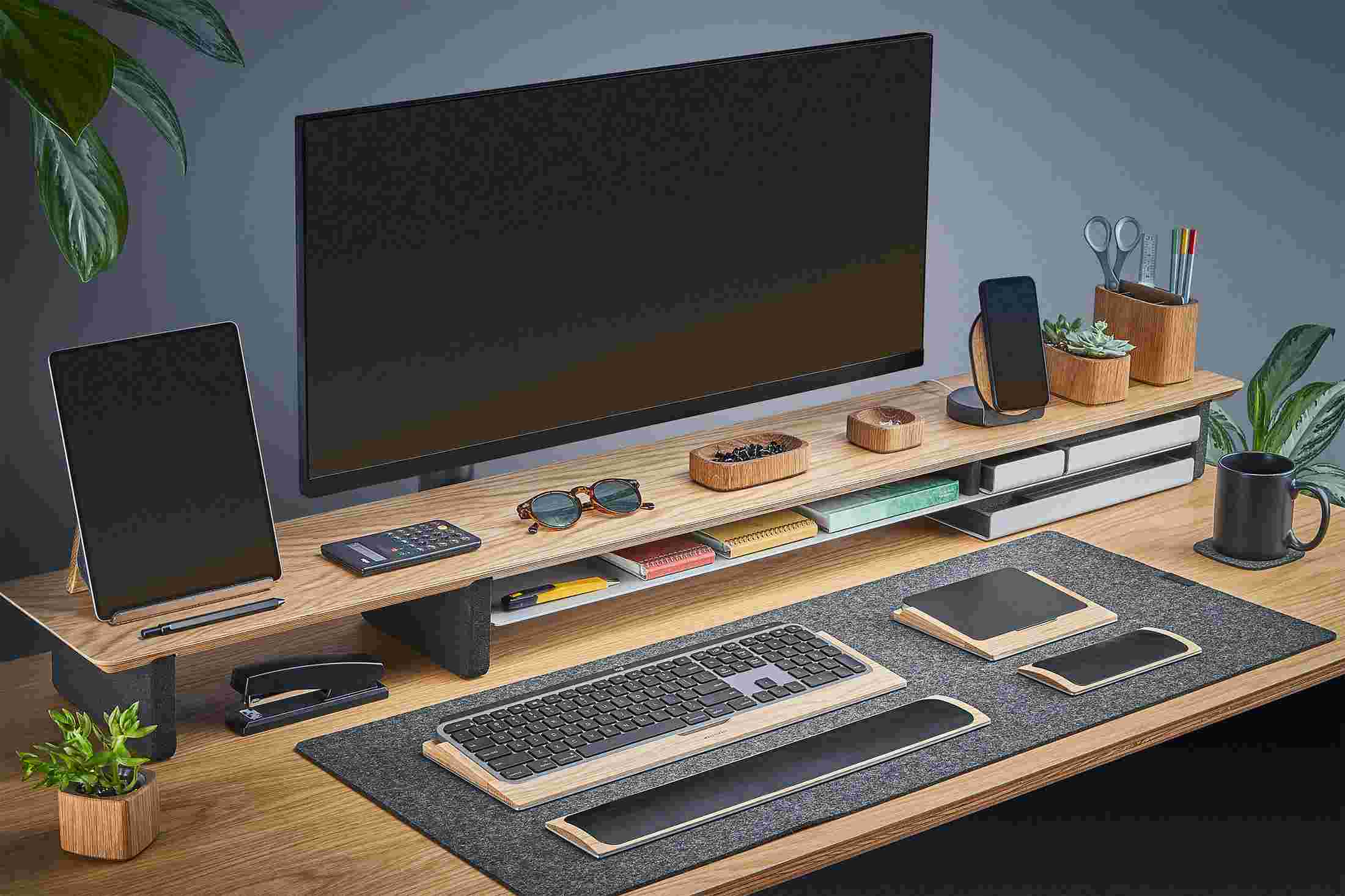 The Extra Large Oak Desk Shelf with ultra-wide monitor, iPad, and iPhone stands, and matching oak accessories.