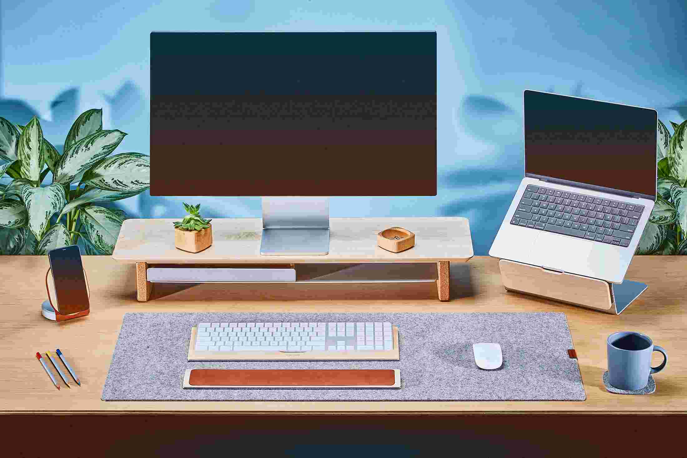 Medium Solid Hardwood Maple Monitor Stand with Apple Studio Display and matching maple laptop stand for MacBook.