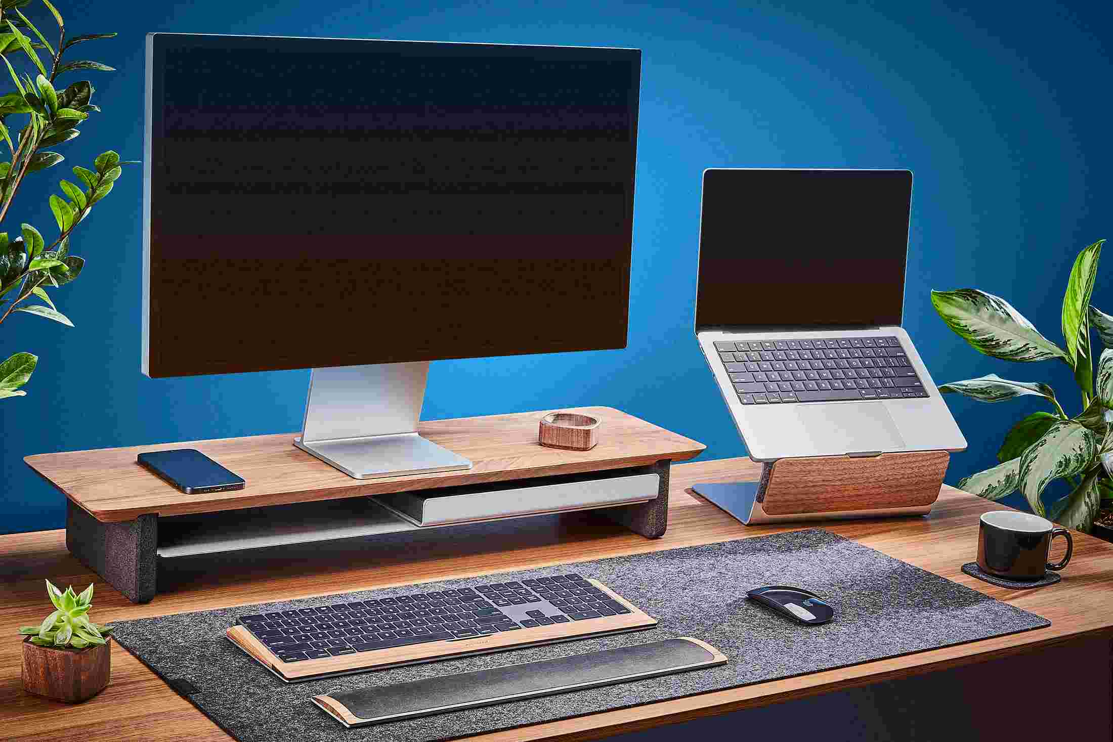Wood laptop lift working in tandem with the Grovemade Desk Shelf.