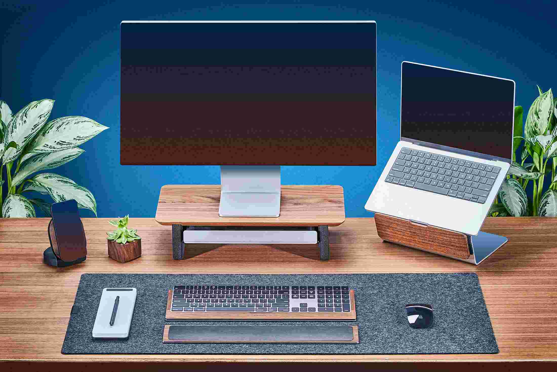Walnut MacBook stand designed to work alongside the iMac.