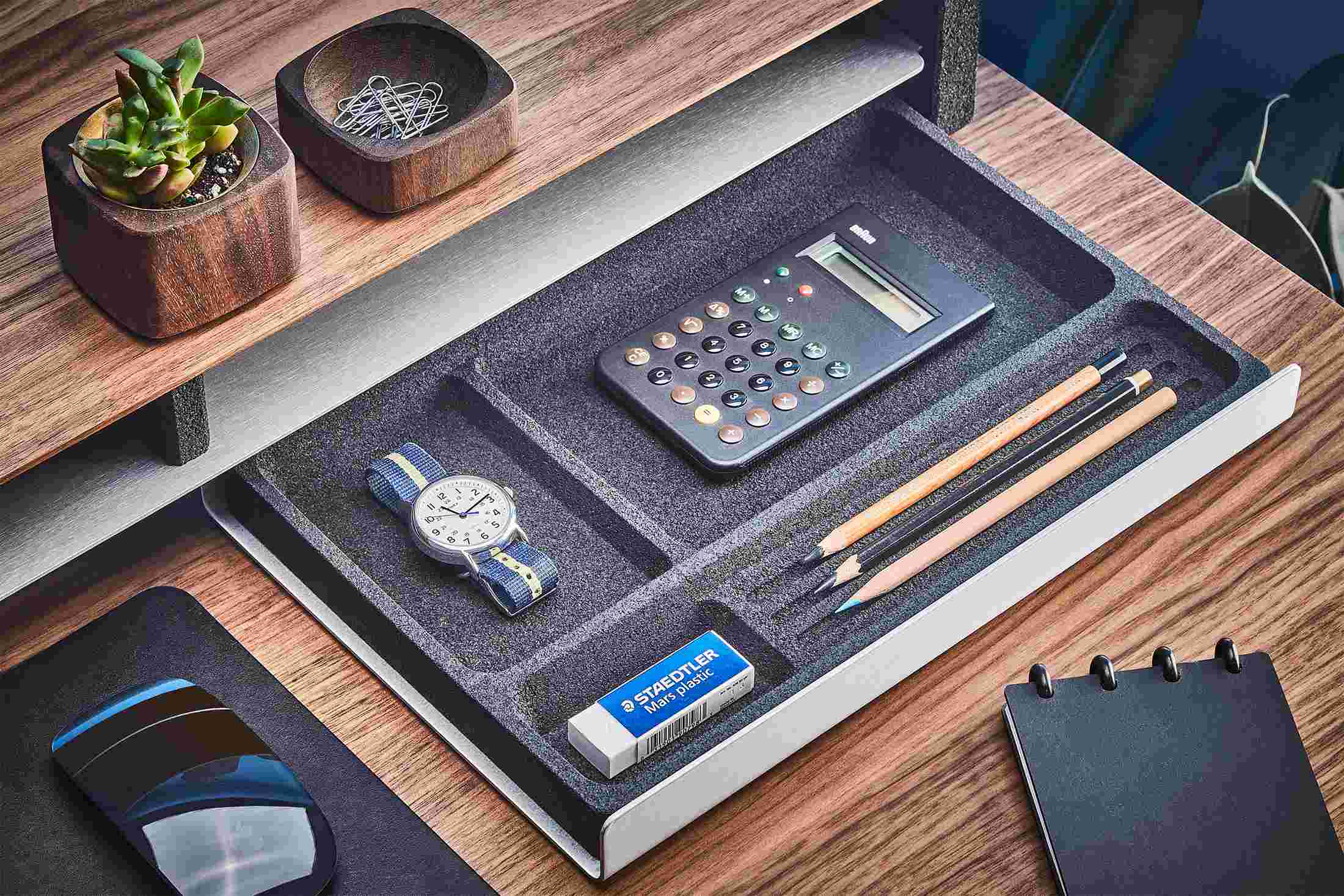 The Desk Tray in black inked cork, pulled out from its slot under the Walnut Wood Desk Shelf.