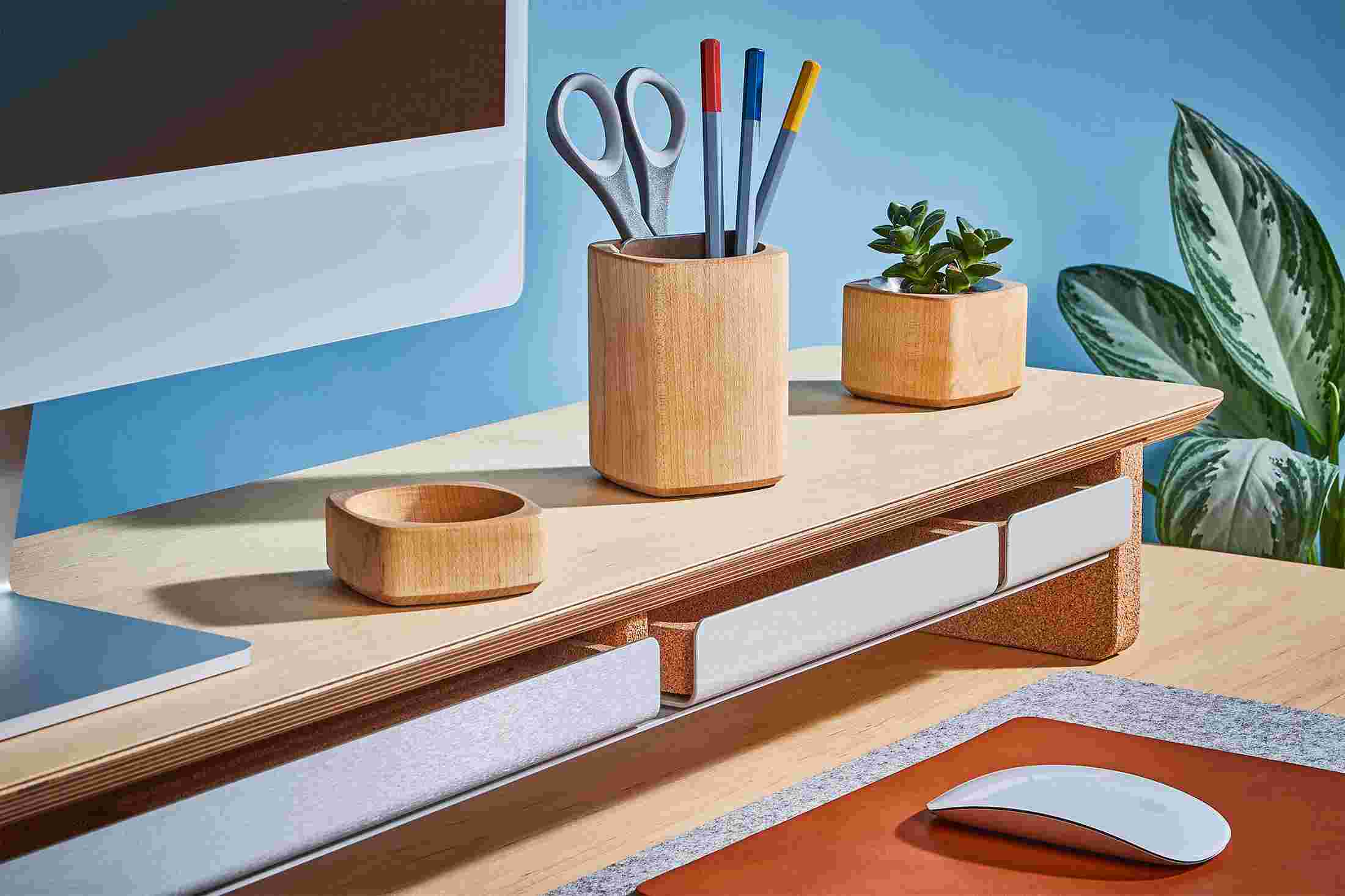 All three sizes of light desk tray pushed in flush into the maple desk shelf's metal recess.