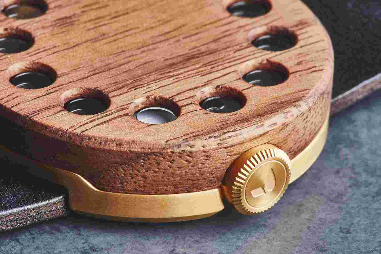 Macro detail of the gold crown on the Grovemade Watch 01.