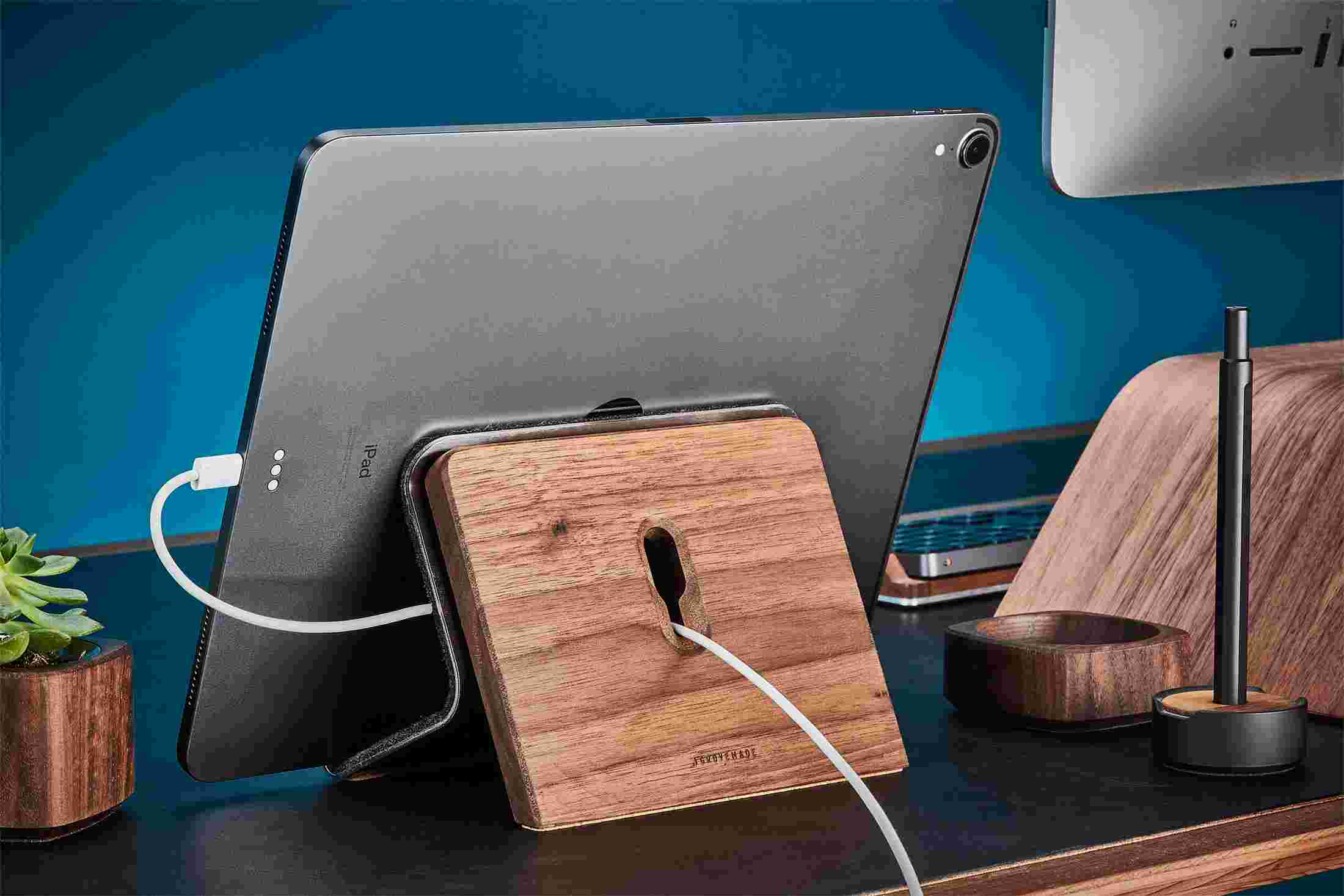 Rear detail of Walnut iPad Stand cord management with keyhole for power cord.