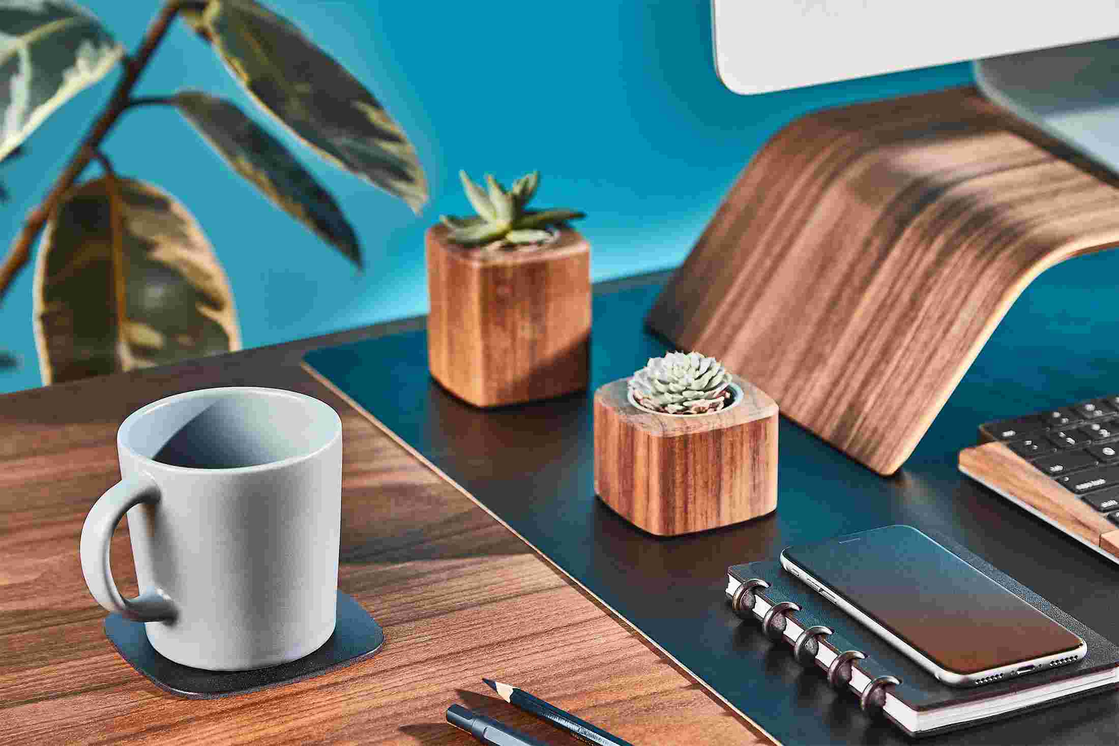 The black leather coaster matching the Grovemade Black Leather Desk Pad.