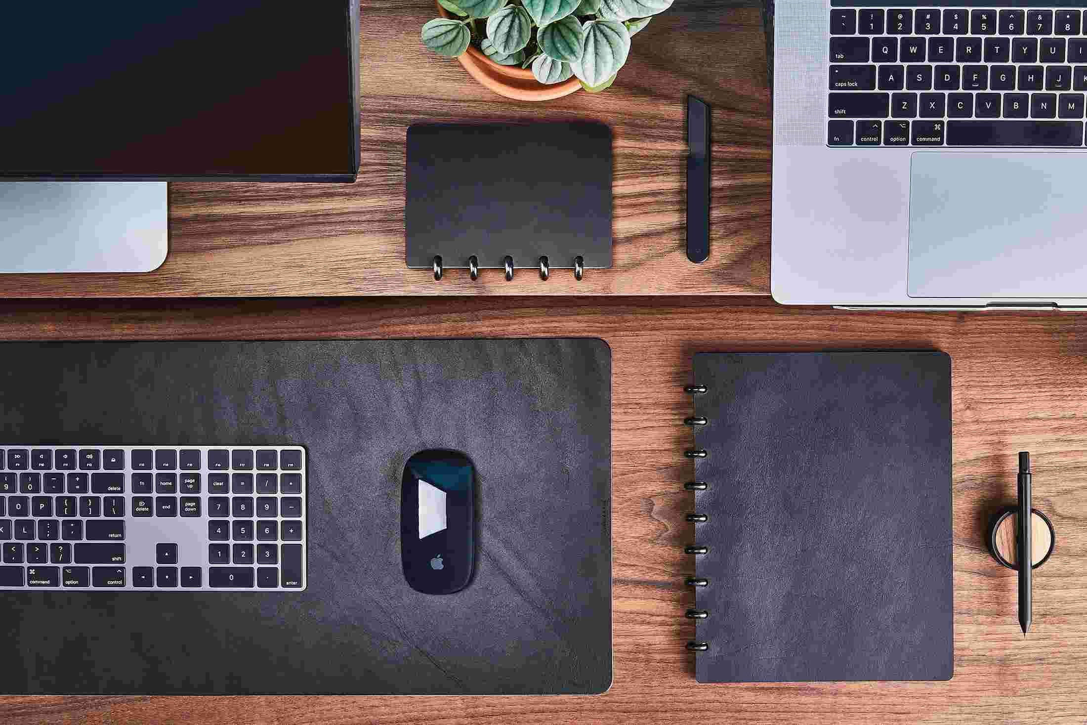 Overhead of the Grovemade Monitor Shelf with large and small discbound notebooks in premium black leather.
