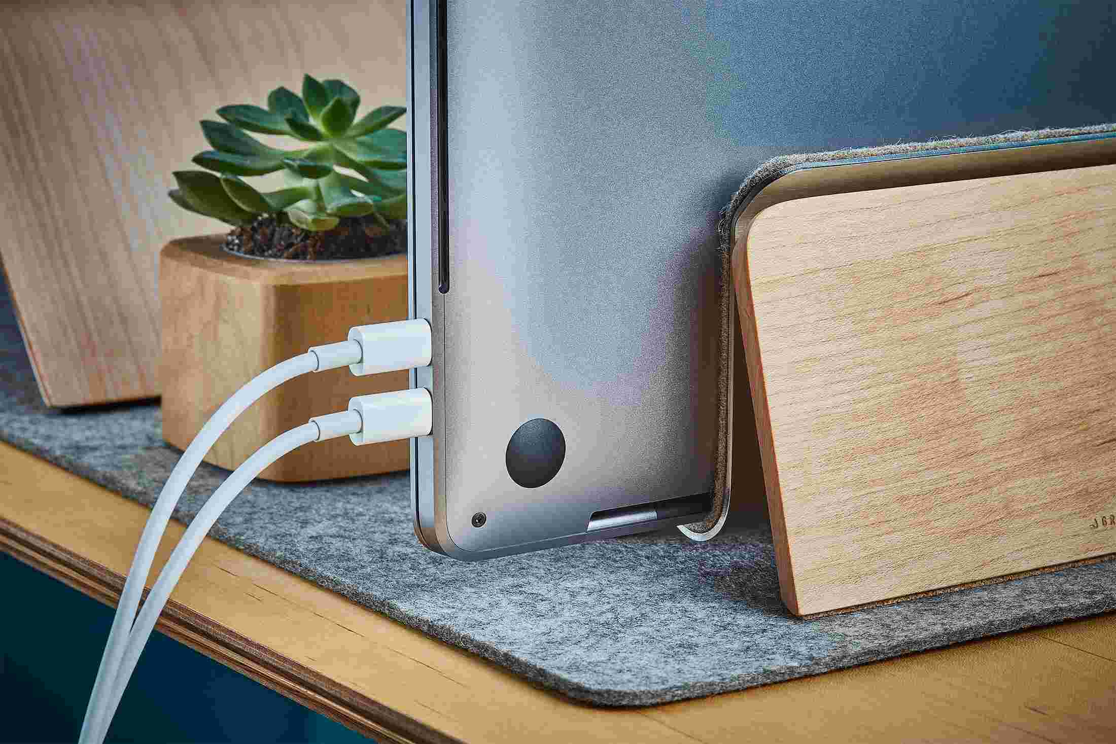 Rear detail of the Maple MacBook Dock, showing cords hidden from sight.
