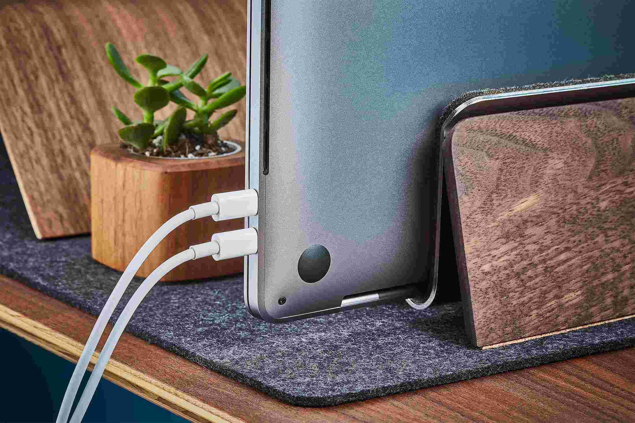 Rear detail of the Walnut MacBook Dock, showing cords hidden from sight.